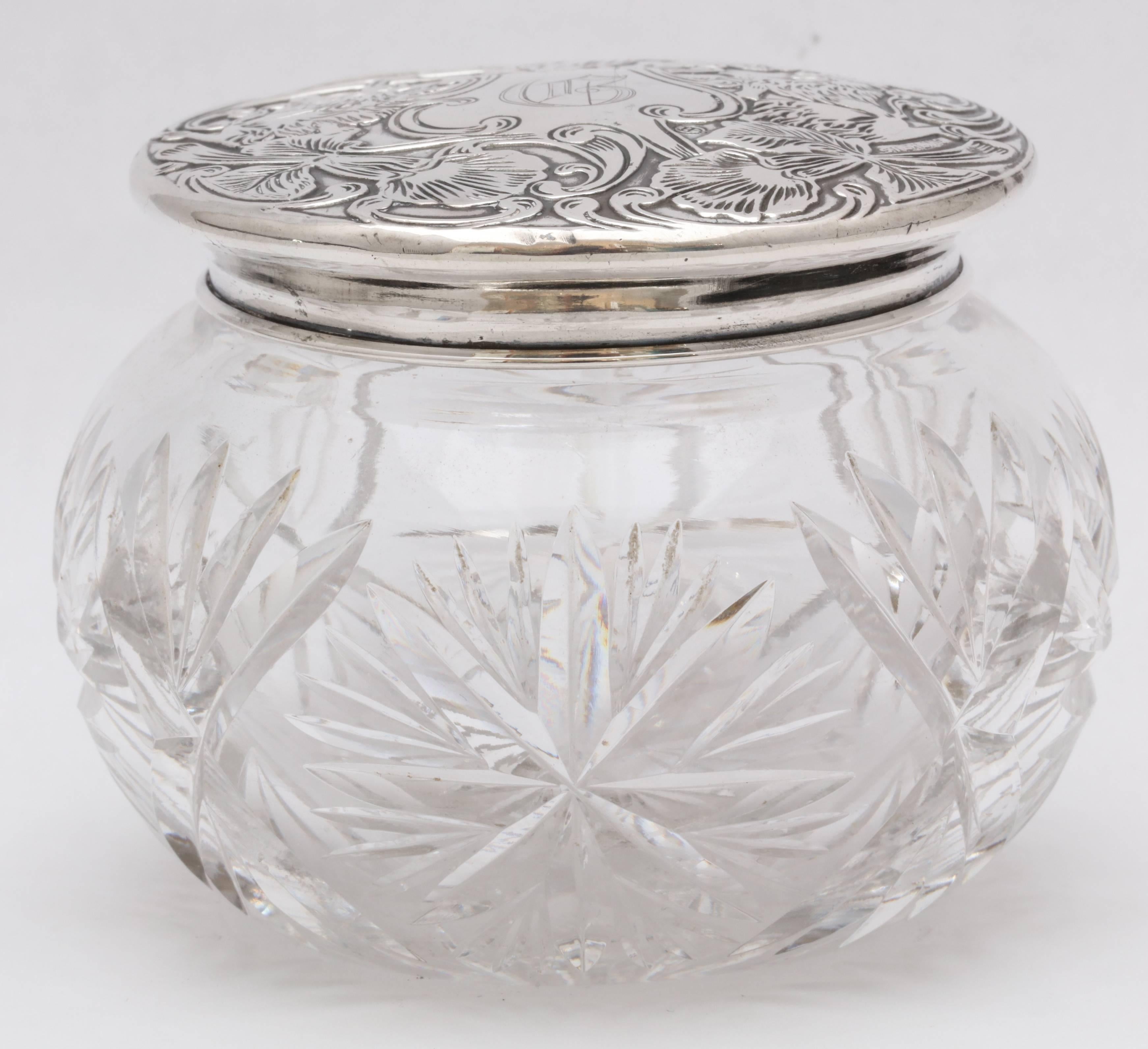 Unusual, Art Nouveau, sterling silver-lidded, cut crystal powder jar, Eastwood-Park Co., Jew Jersey, circa 1909-1915. The lid has a motif of two lions rampant holding a central cartouche in the form of a shield. The cartouche is engraved with the