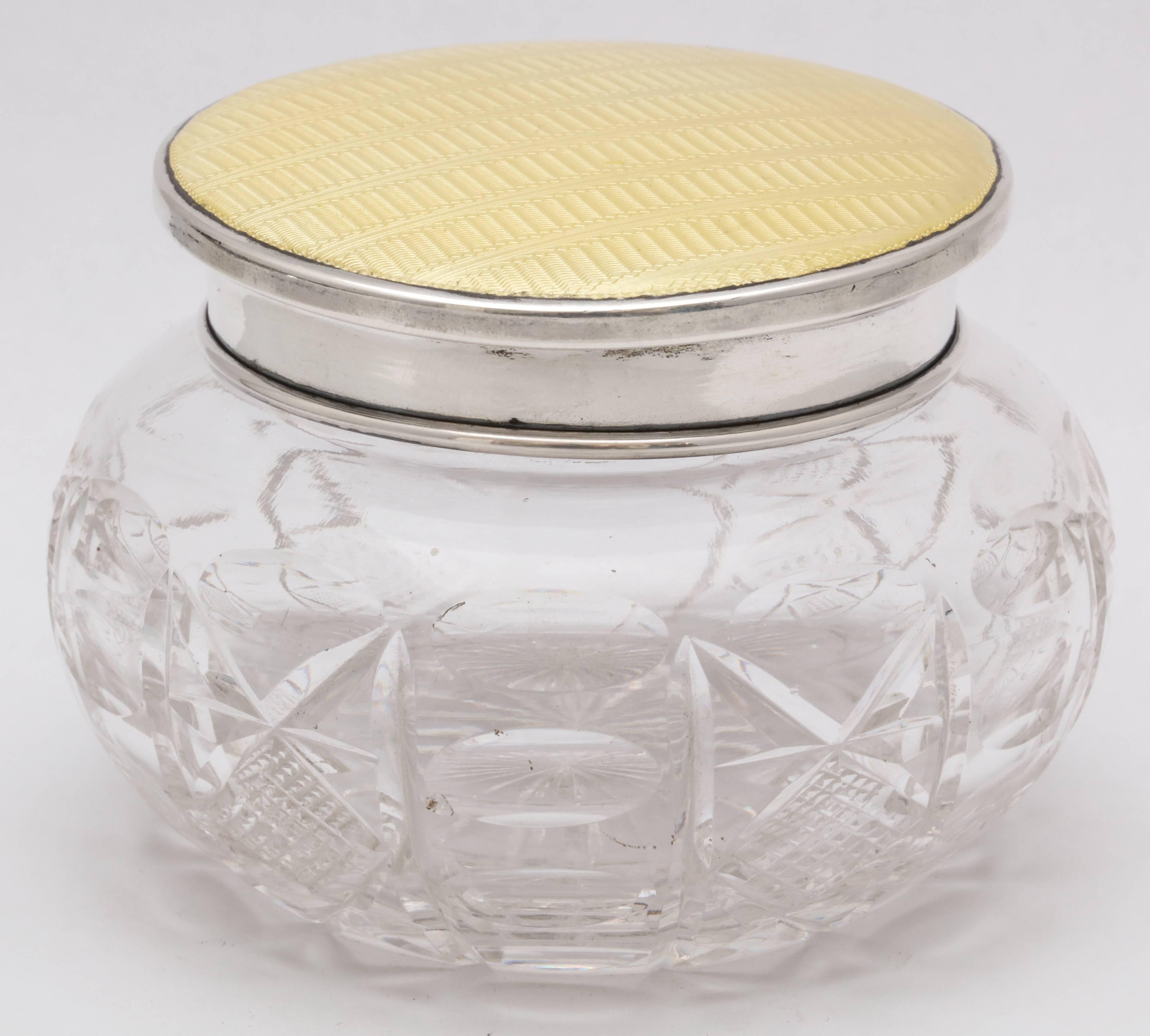 Beautiful, Art Deco, sterling silver and yellow guilloche enamel-mounted cut crystal powder jar, Birmingham, England, 1929, Adie Bros. - makers. The yellow guilloche enamel that decorates the lid is designed to look like ribboned fabric. Crystal is