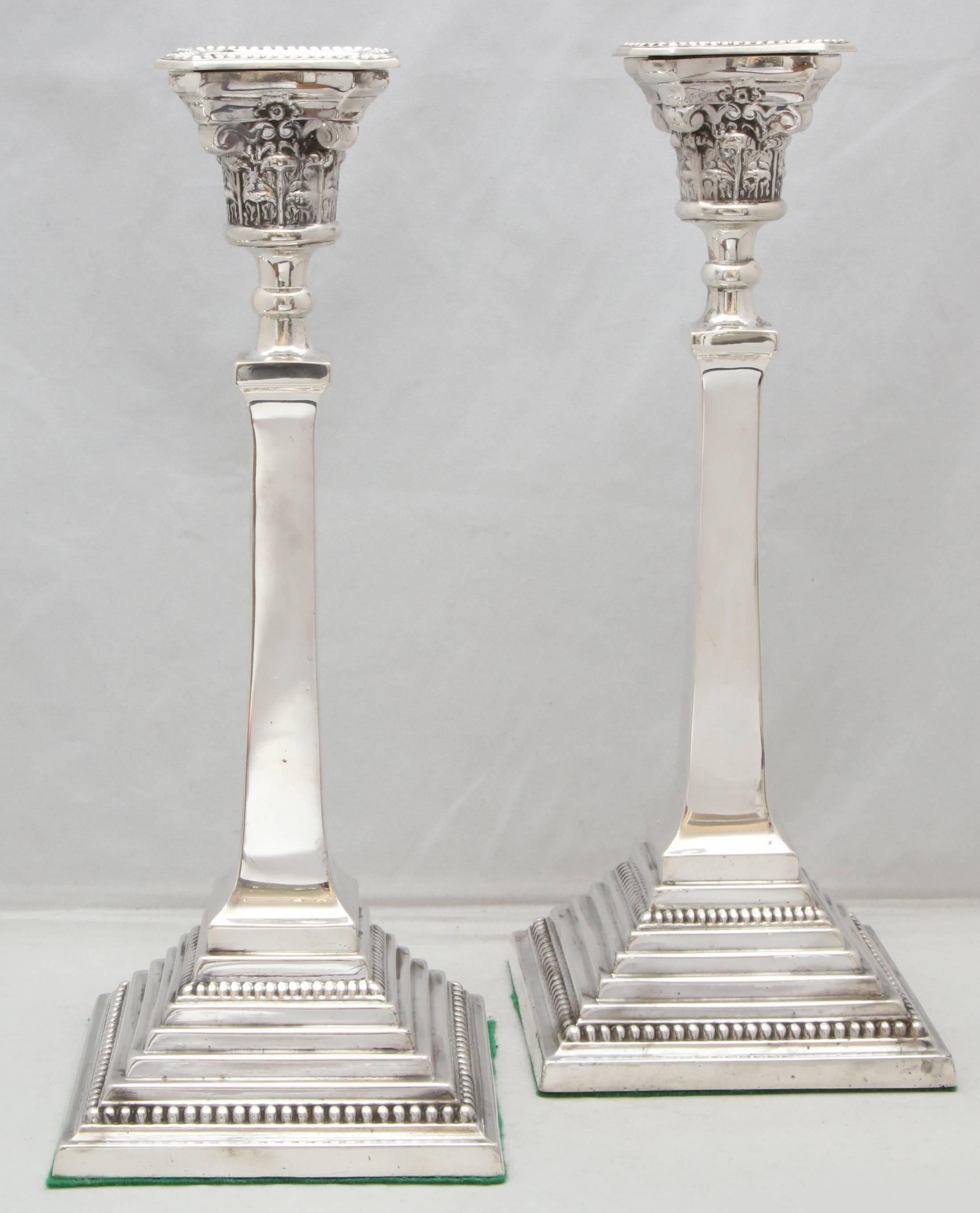 Tall, Edwardian, sterling silver, neoclassical, column-form candlesticks, Birmingham, England, 1914, Bayliss and Coulthard - makers. Measures: 12 1/2 high x 5 wide x 5 deep (at square base of each). Weighted. Beaded motif on bases of each is picked