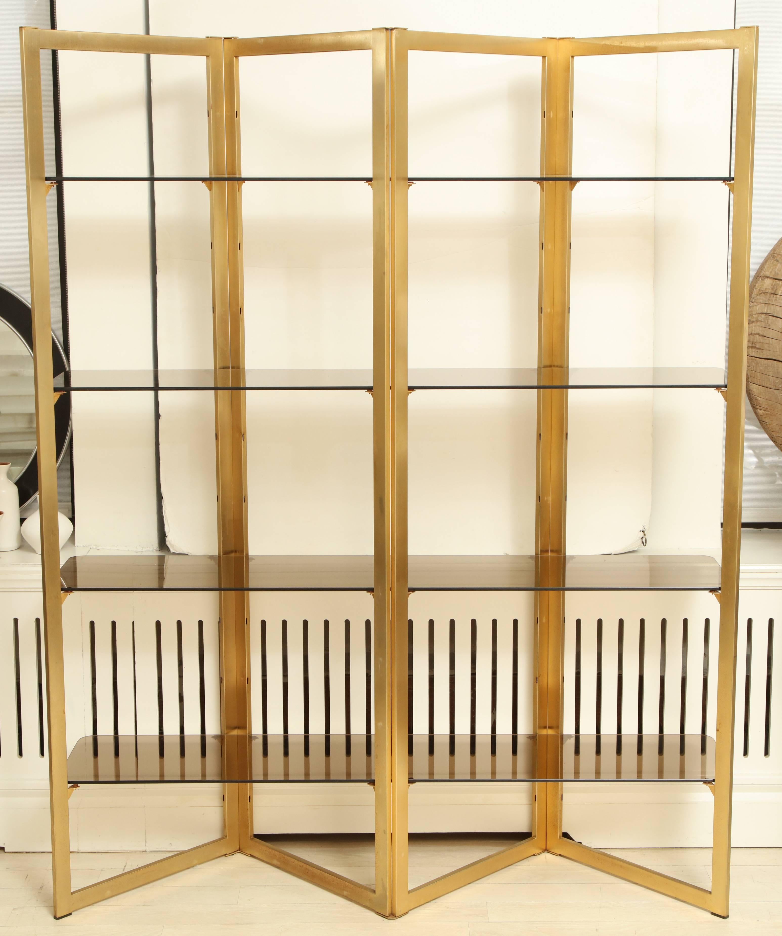 Mid-Century brass zig-zag étagère with four smoked glass adjustable shelves. Two available.

Overall dimensions:
60” W x 14” D x 77” H


Available to see in our NYC Showroom 
BK Antiques
306 East 61st St. 2nd fl.
New York, NY 10065