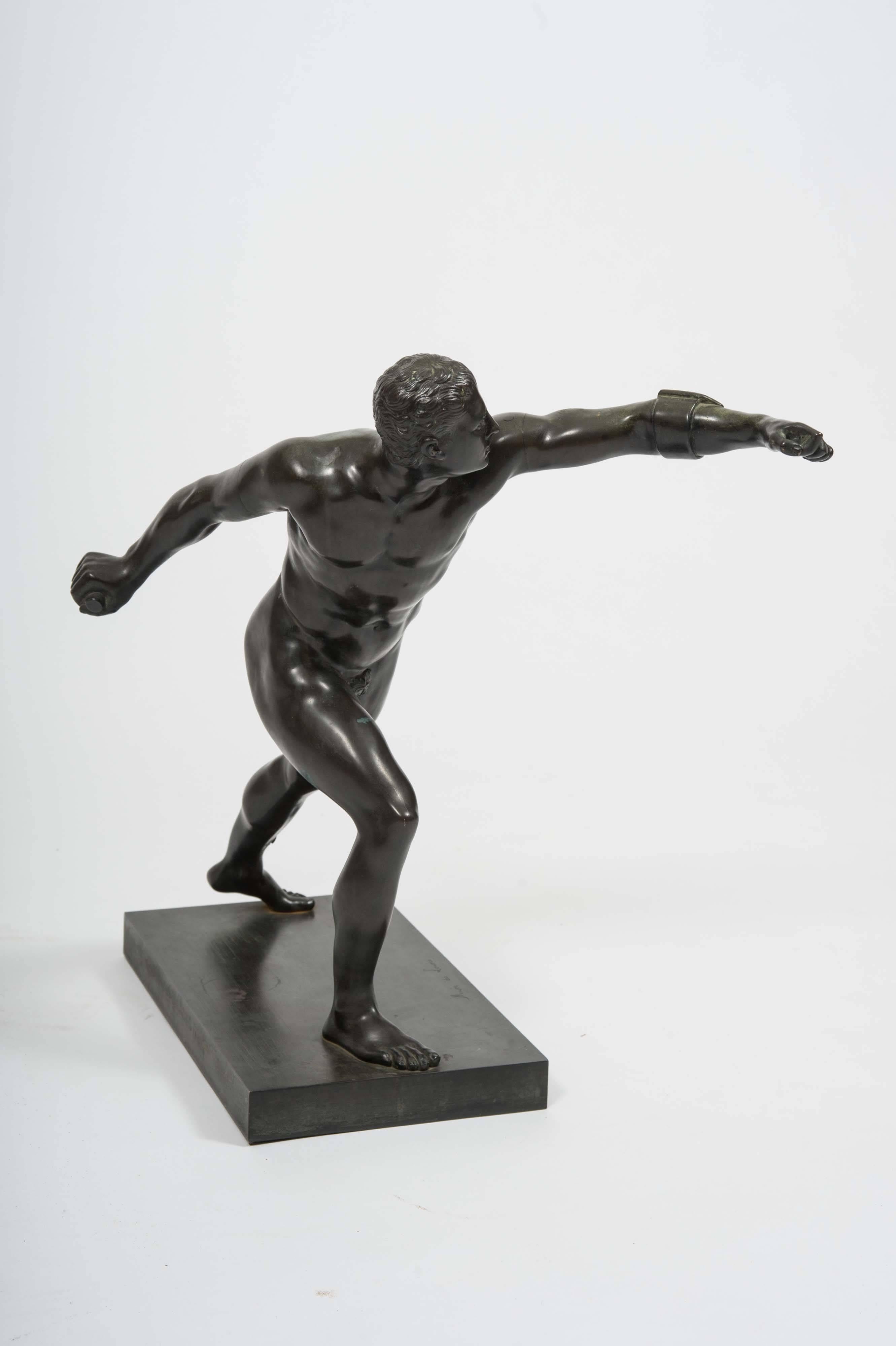 This handsome and well-proportioned French bronze depicts a Greek male nude in a fighting pose. It is a reproduction of the original sculpture that resides in the Louvre Museum in France, titled The Borghese Gladiator - originally part of the