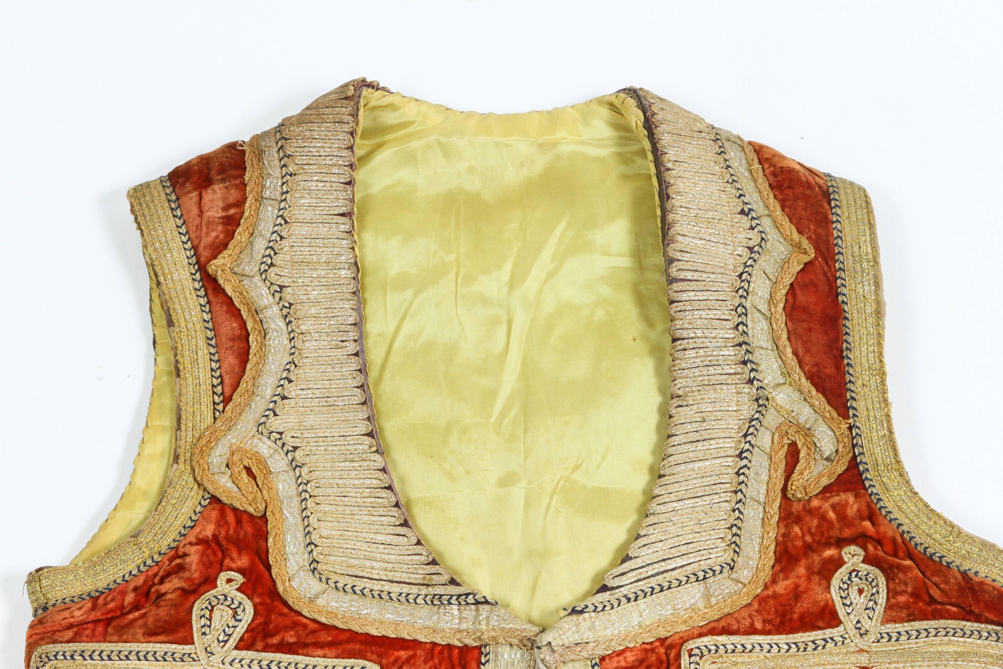 Authentic late 19th century antique ottoman Turkish vest in red velvet decorated with elaborate gold thread, trimmed with gold metallic thread.
Elegant vest handmade embroidery on red velvet, fully lined with gold yellow silk and fabric.
This