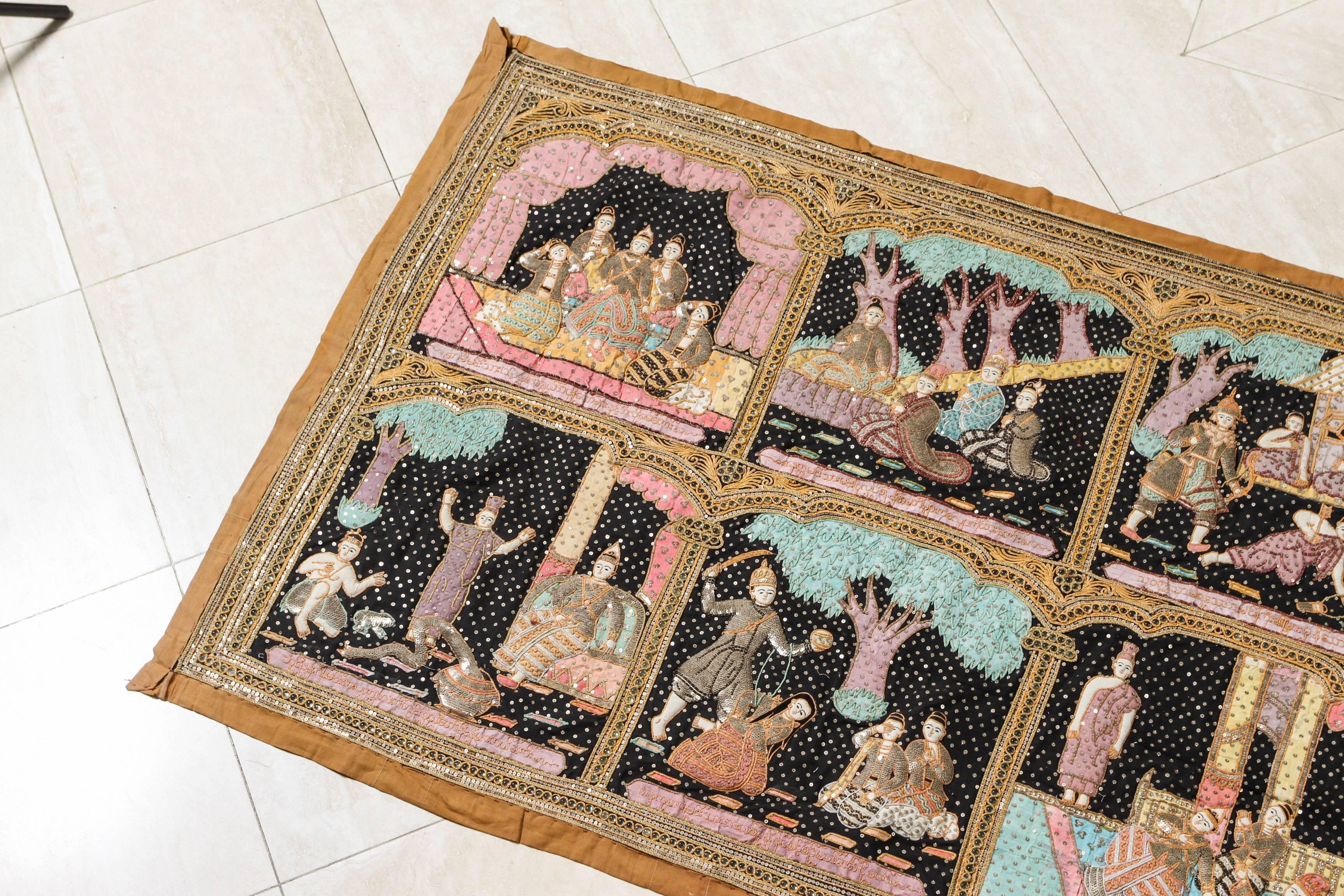Fabulous large Kakaga Burmese bead embroidered adorned with sequins and beads tapestry wall hanging .
This vintage handcrafted needlework wall hanging tapestry shows ten different scenes from the ancient epic Hindu poem, the Ramayana, or from