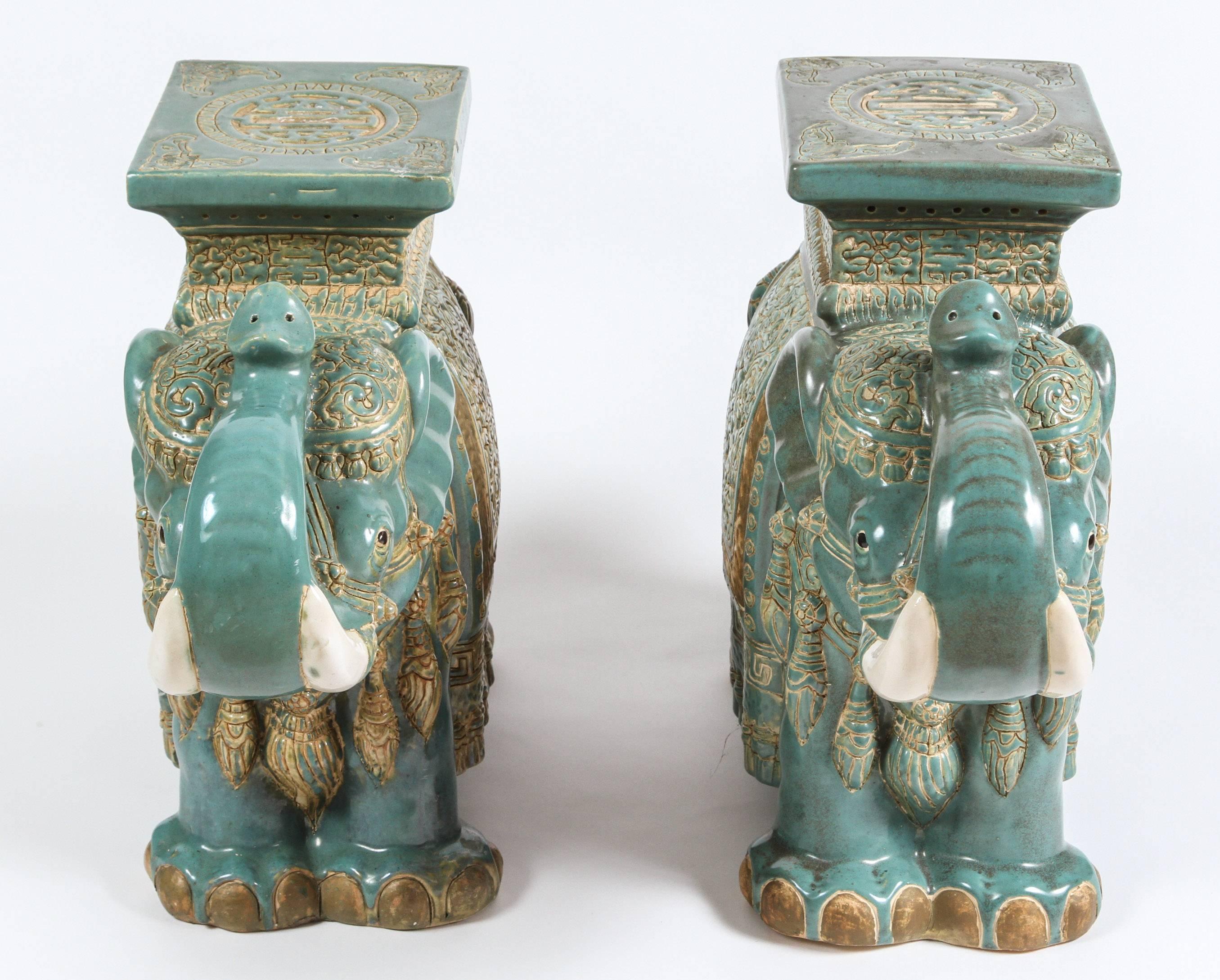 Large pair of vintage Mid-Century Asian Chinese elephant garden stools.
Great details in aqua and gold colors.
Use them indoor or outdoor, as stools, pedestals or side tables.
Hollywood Regency, Moorish style, circa 1950s.