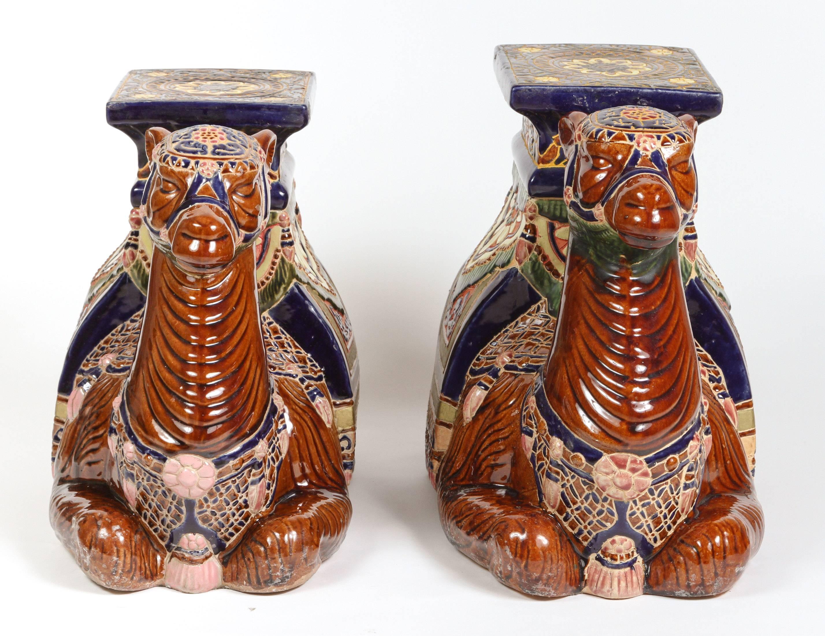 Pair of highly decorative hand-crafted Moroccan camels glazed ceramic garden seats.
1950s poly-chrome glazed ceramic garden stools.
Beautiful bright colors and crisp details, these stools could be use for plant stand, side tables or also to make a