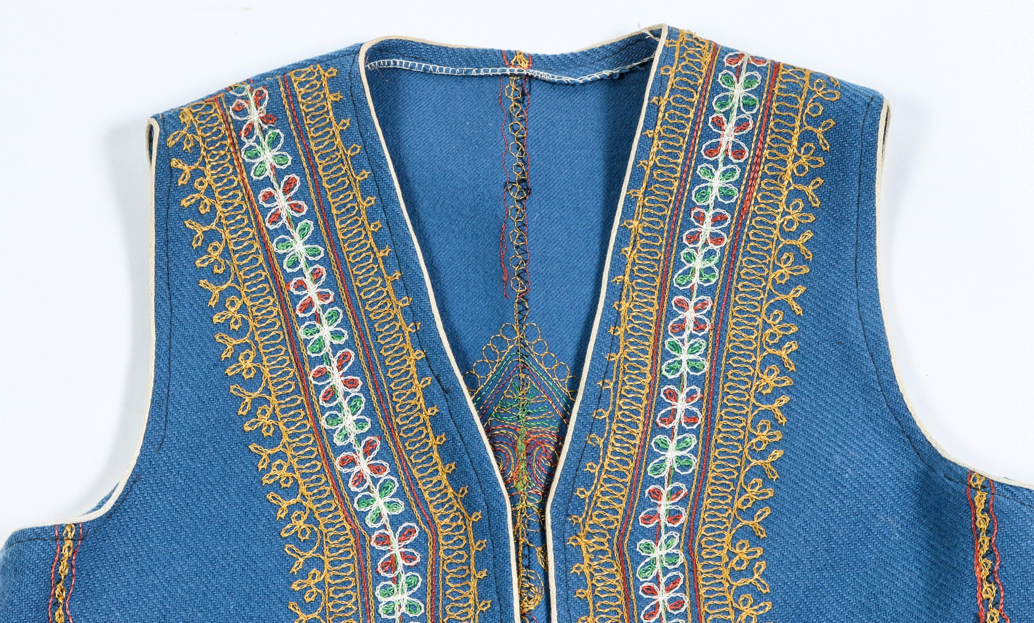 Authentic Ottoman Turkish vest in blue decorated with elaborate embroidered and two pockets,
Part of the traditional Turkish folk costume. 
Measurements: 
height 24.5"
armpit 19".