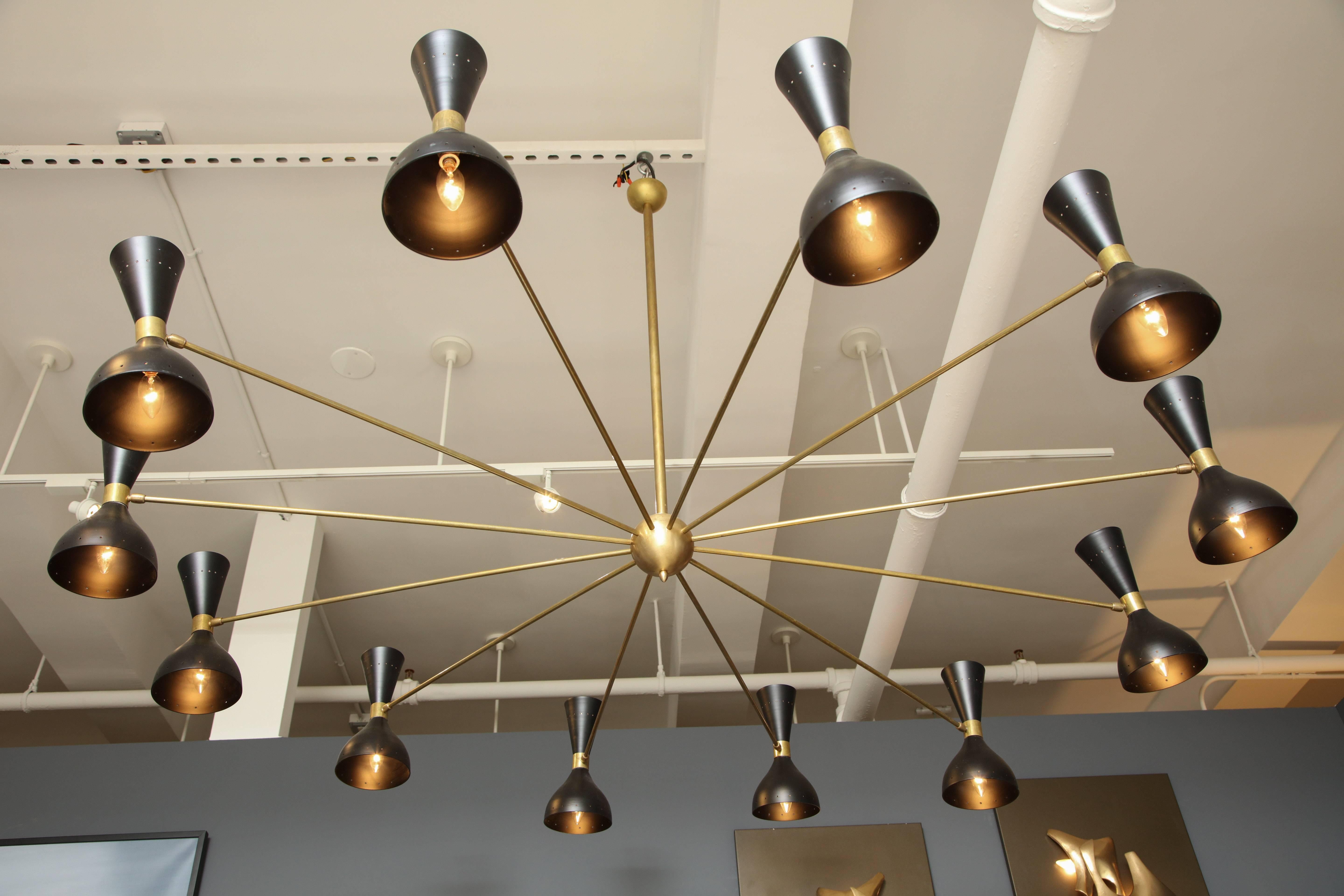 Large chandelier with black lacquered shades and brass stem in the style of Stilnovo.