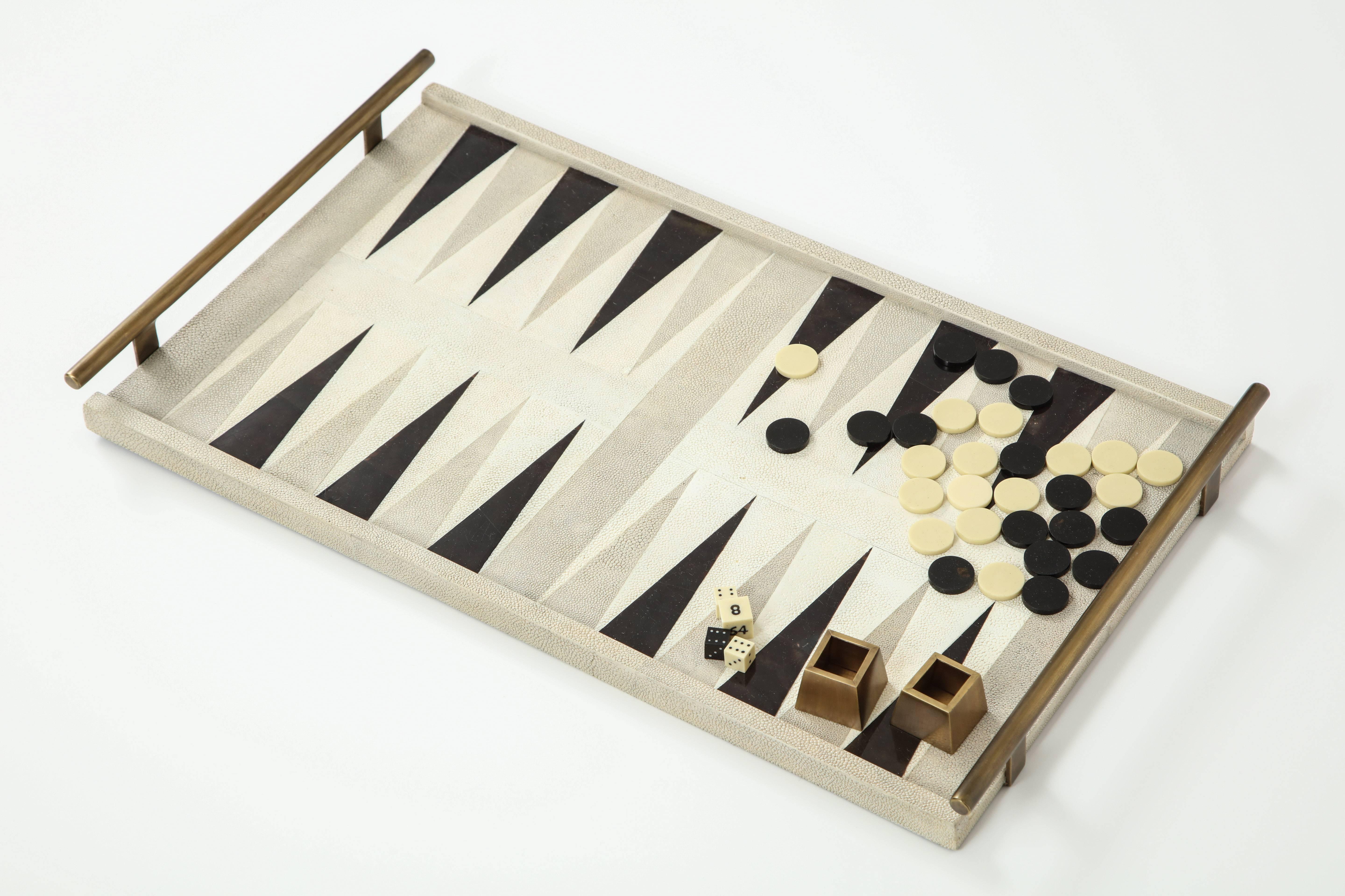 Backgammon board designed of grey shagreen, cream and black sea shell with bronze details. We have one in stock at our NYC showroom.