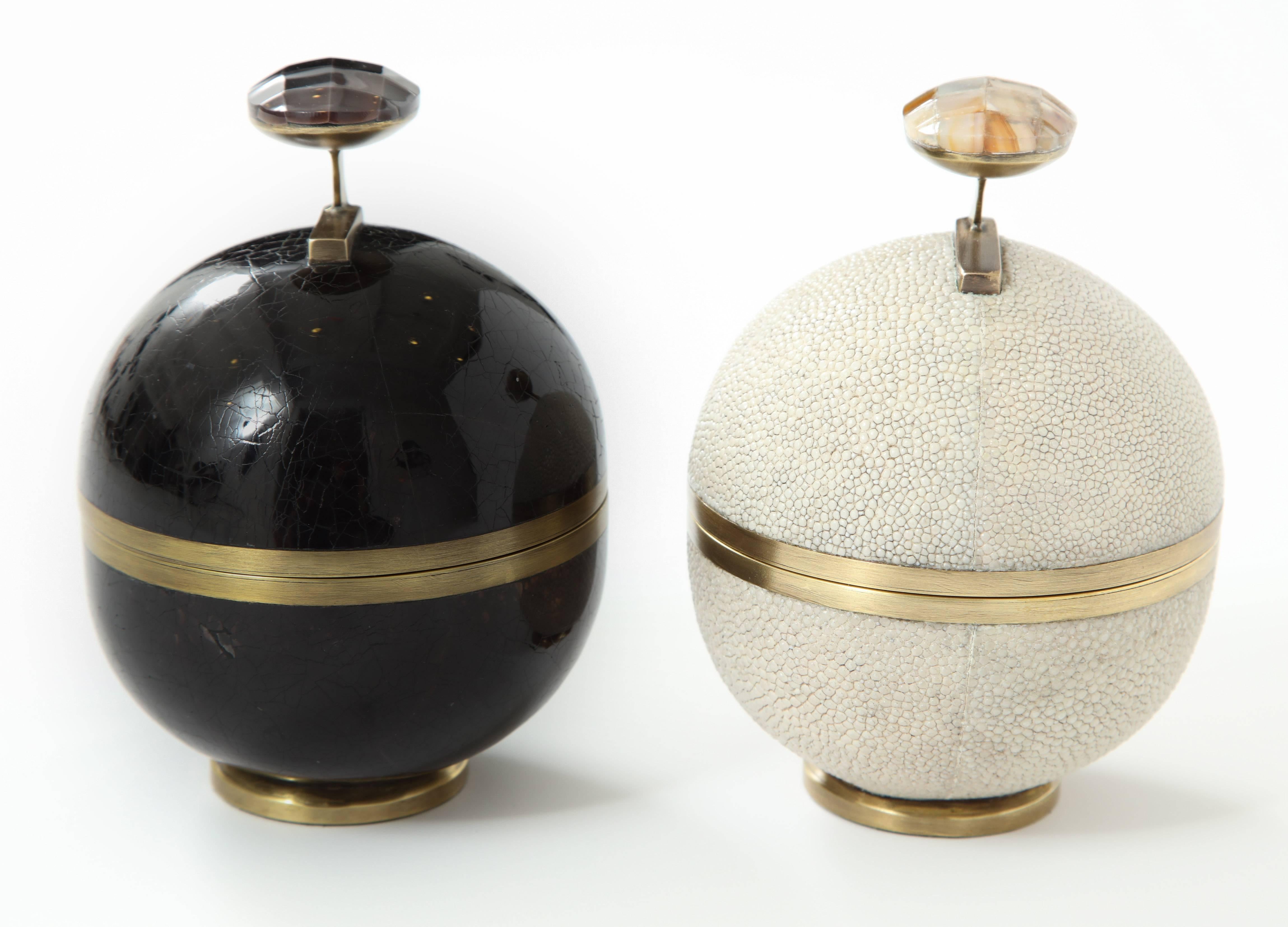 Pair of decorative boxes, shagreen and black sea shell with bronze details. Each box is priced at $495. The shagreen box is sold. France.