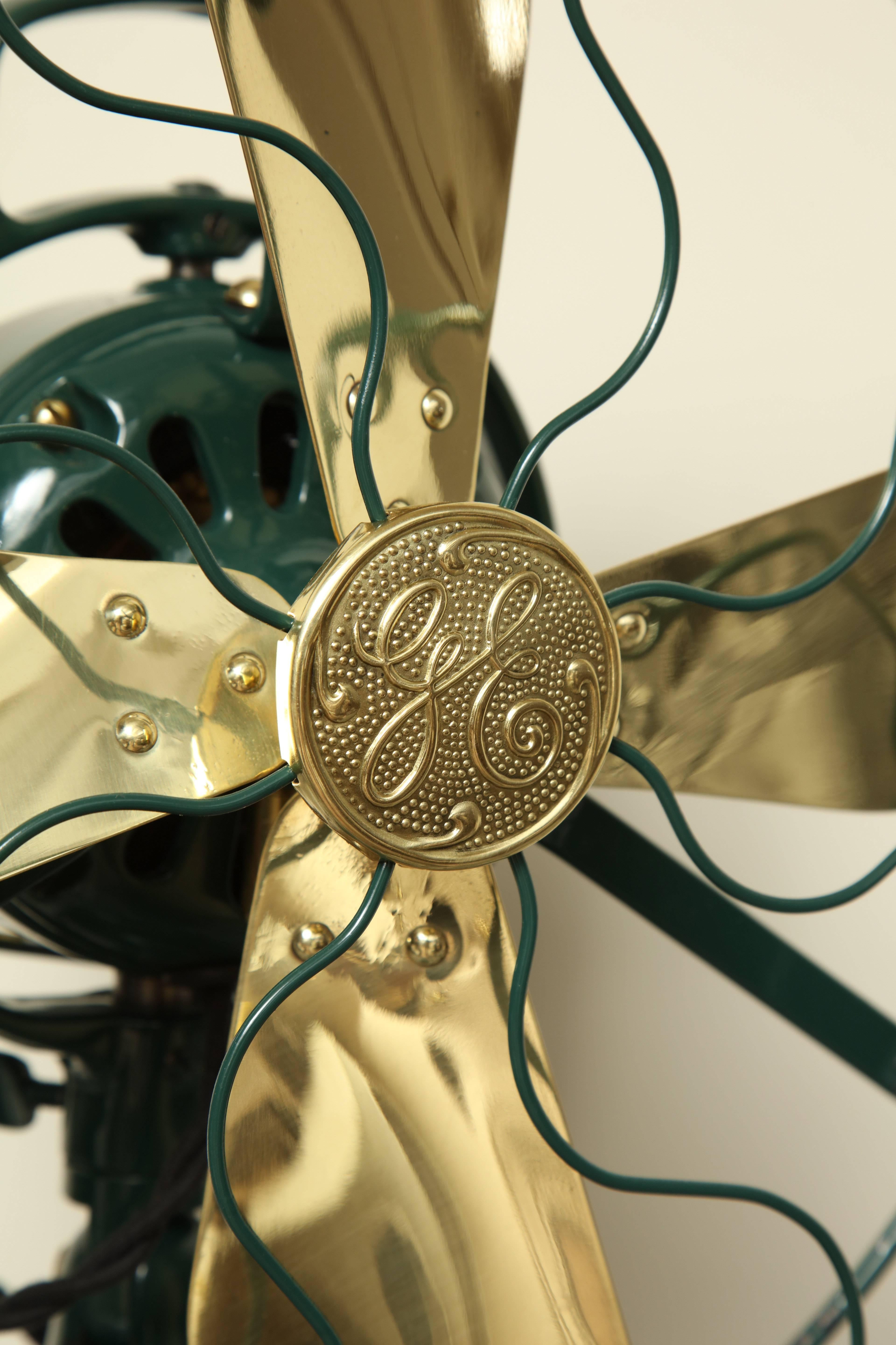 1920s General Electric three-speed oscillating fan with solid brass blade and green powdercoated body - restored professionally, maintain with oil every 3 months of use.