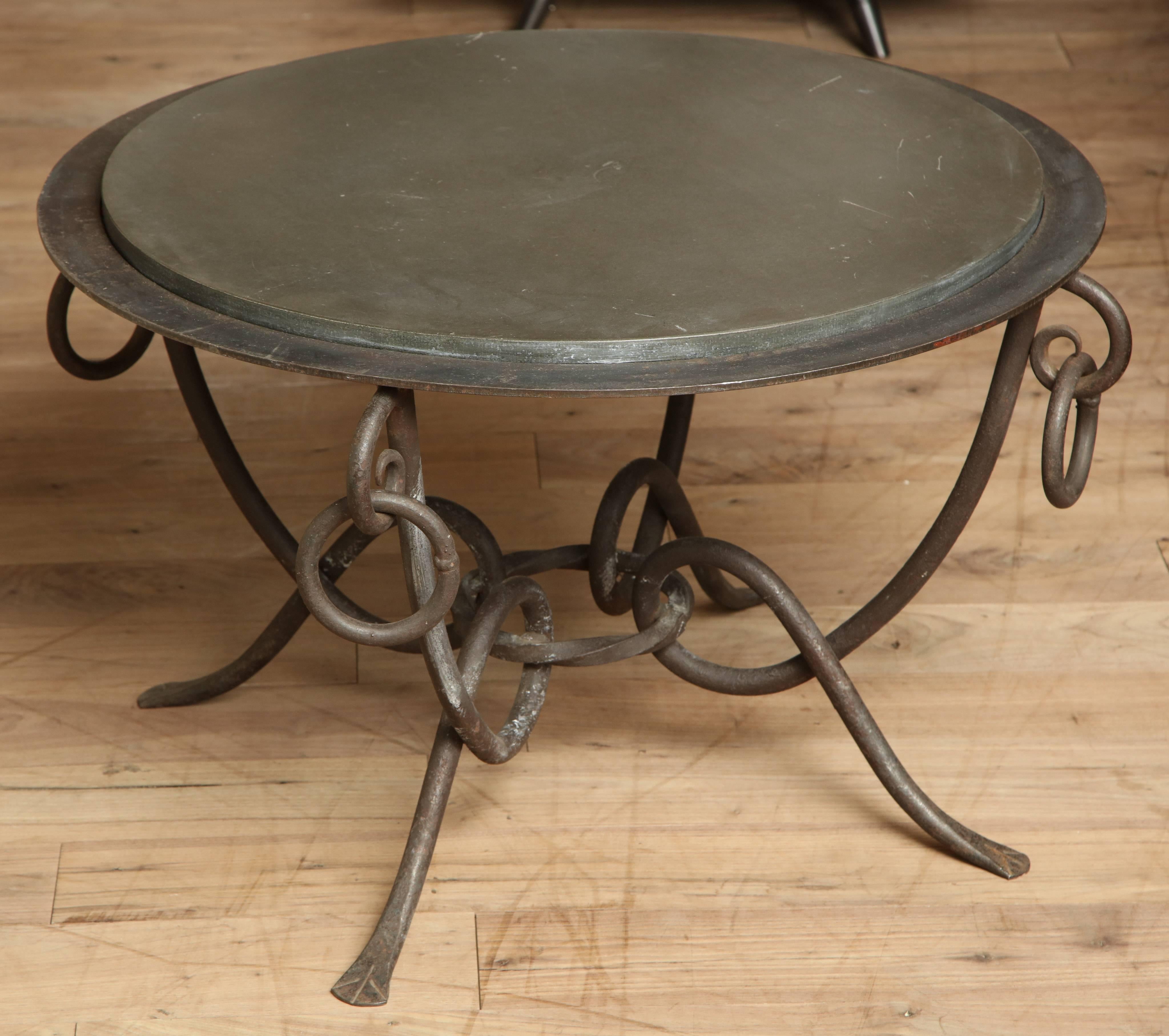 Wrought iron French side table with round inset top, circa 1940.