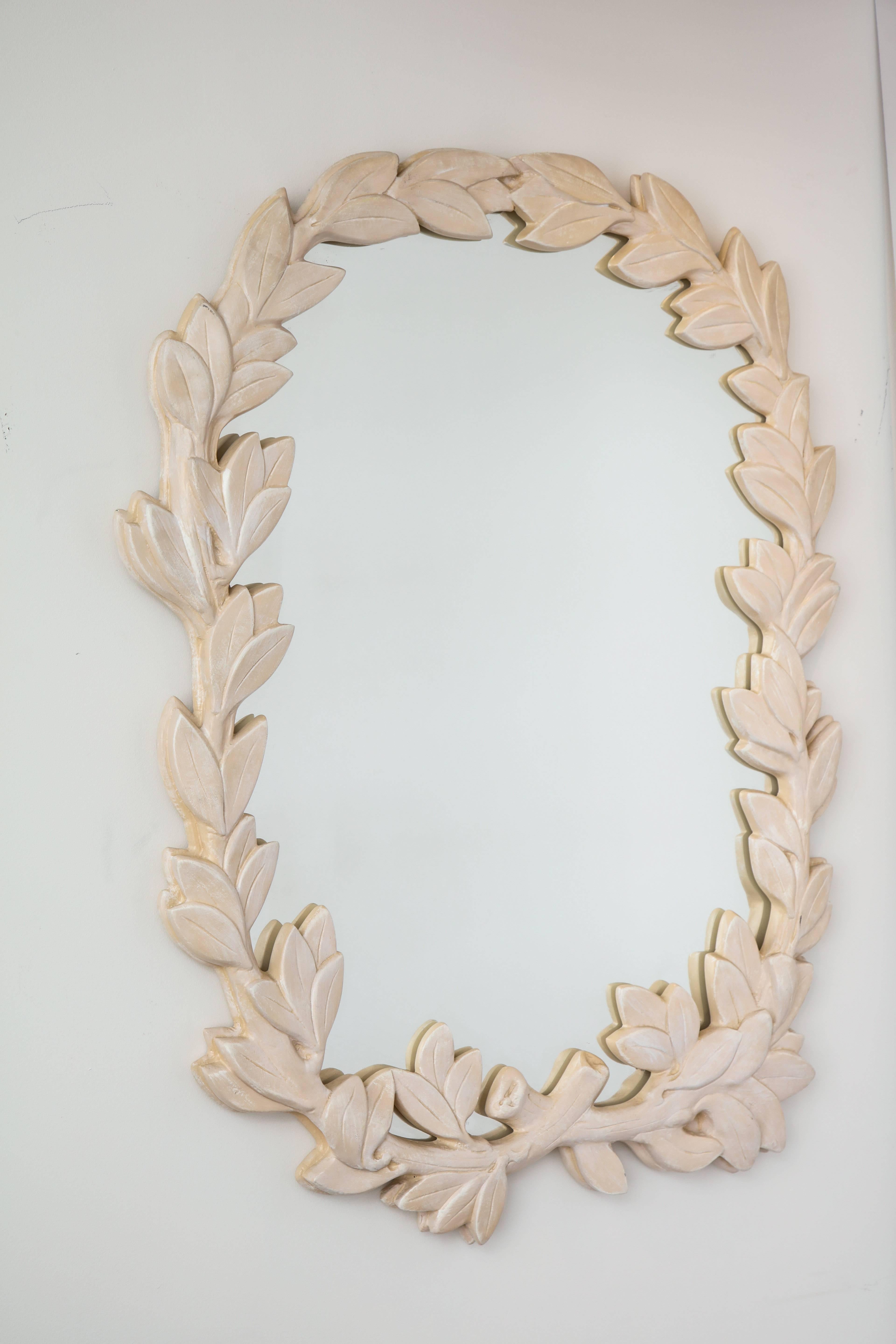 Elegant plaster composition mirror in the form of an asymmetrical wreath of leaves by Los Angeles designer Phyllis Morris.
