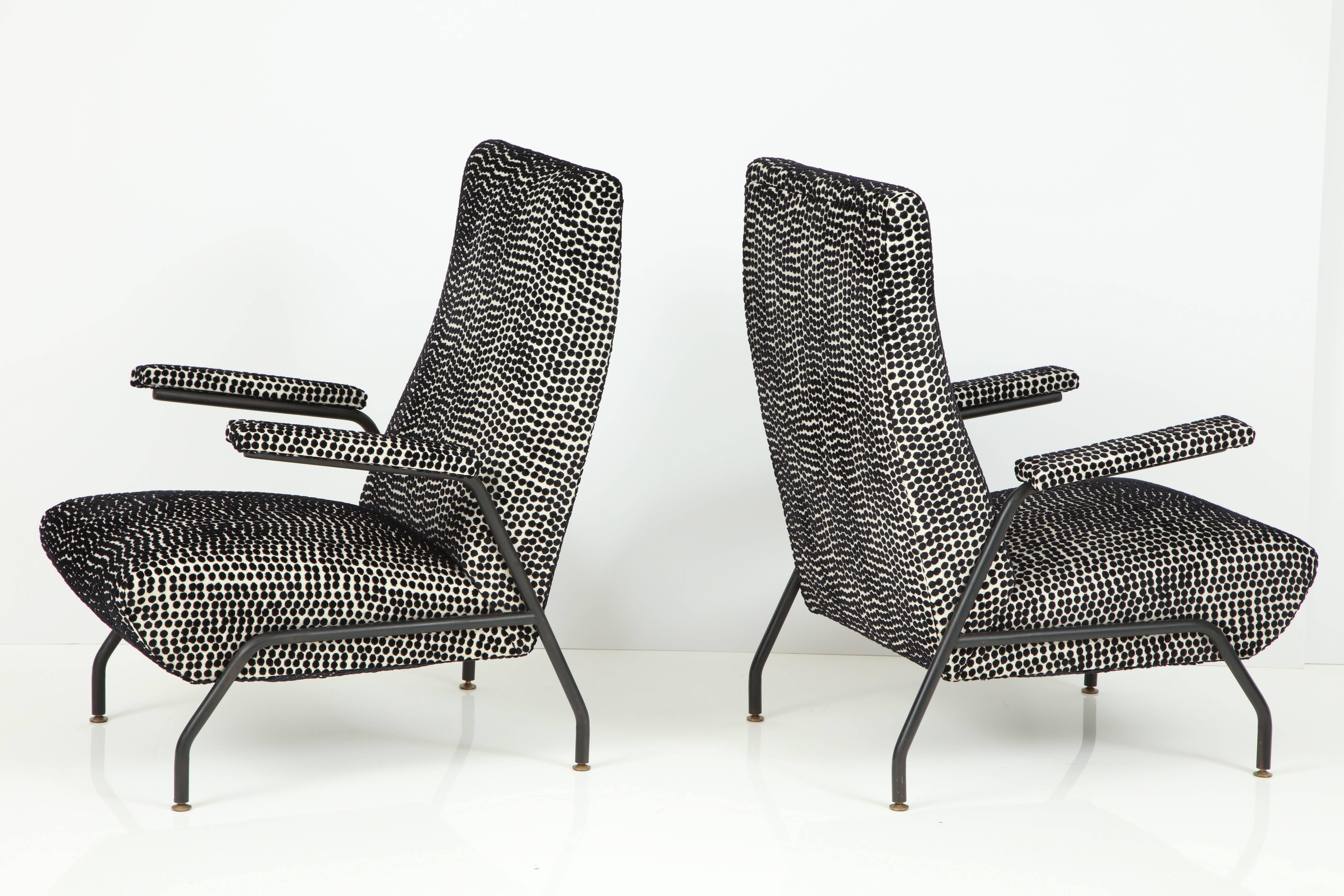 Pair of Italian Mid-Century Modern armchairs or lounge chairs with black enameled steel frame and legs.  Brass cap details. Sturdy and solid.  Completely renovated and newly upholstered in Florence, Italy, in a French imported black and white polka