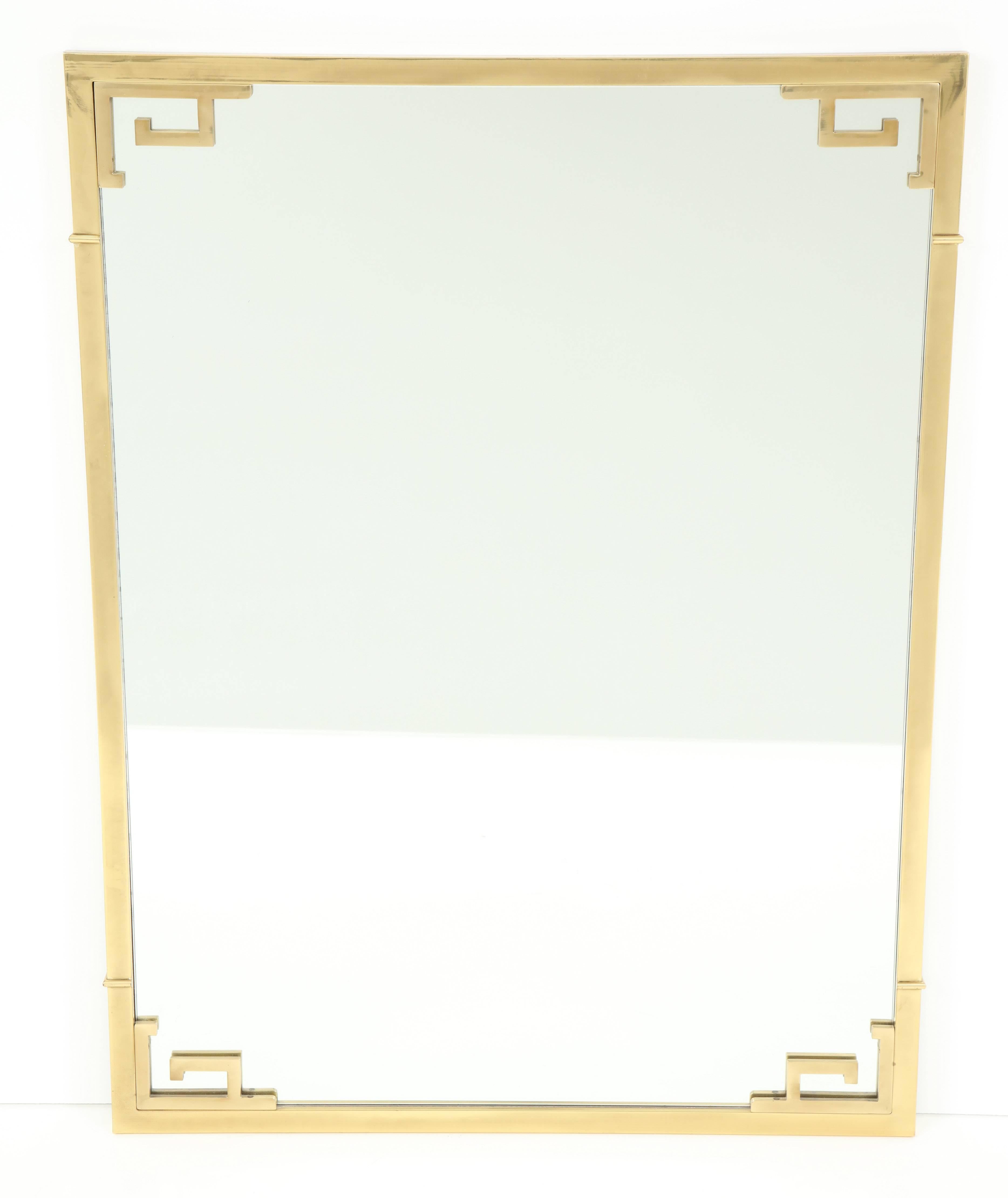 Large Mid-Century solid brass Greek key mirror with refined details. Gorgeous patina. Attributed to Mastercraft and stamped 