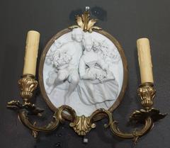 Pair of Antique Carved Bisque Sconces in Bronze