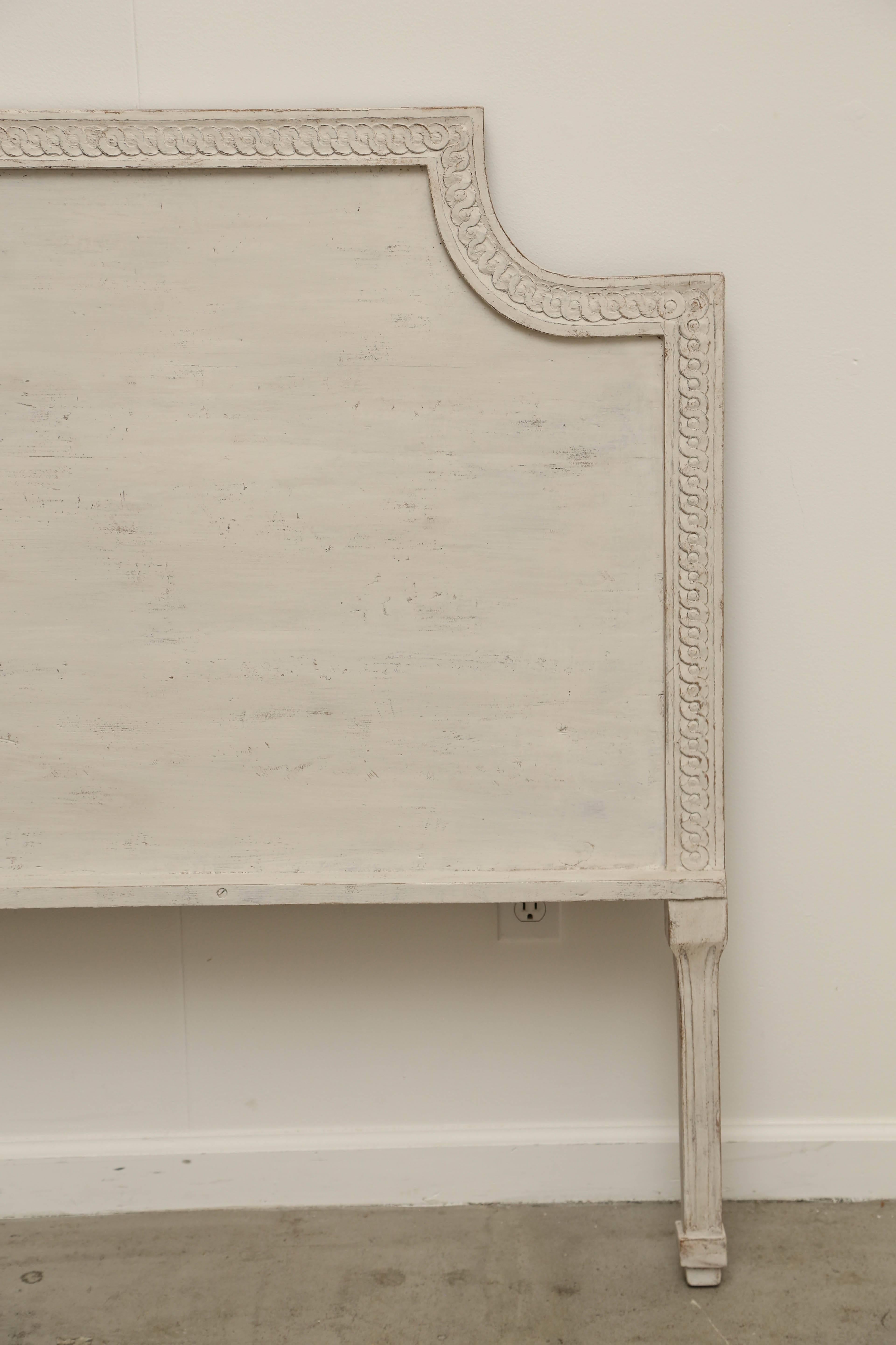 Antique Swedish Gustavian style painted headboard, 19th century
Classic rectangular shape with curved ends with interlocking circle border set into a frame border. Tapered fluted legs added to raise the height and decorative
Refreshed painted