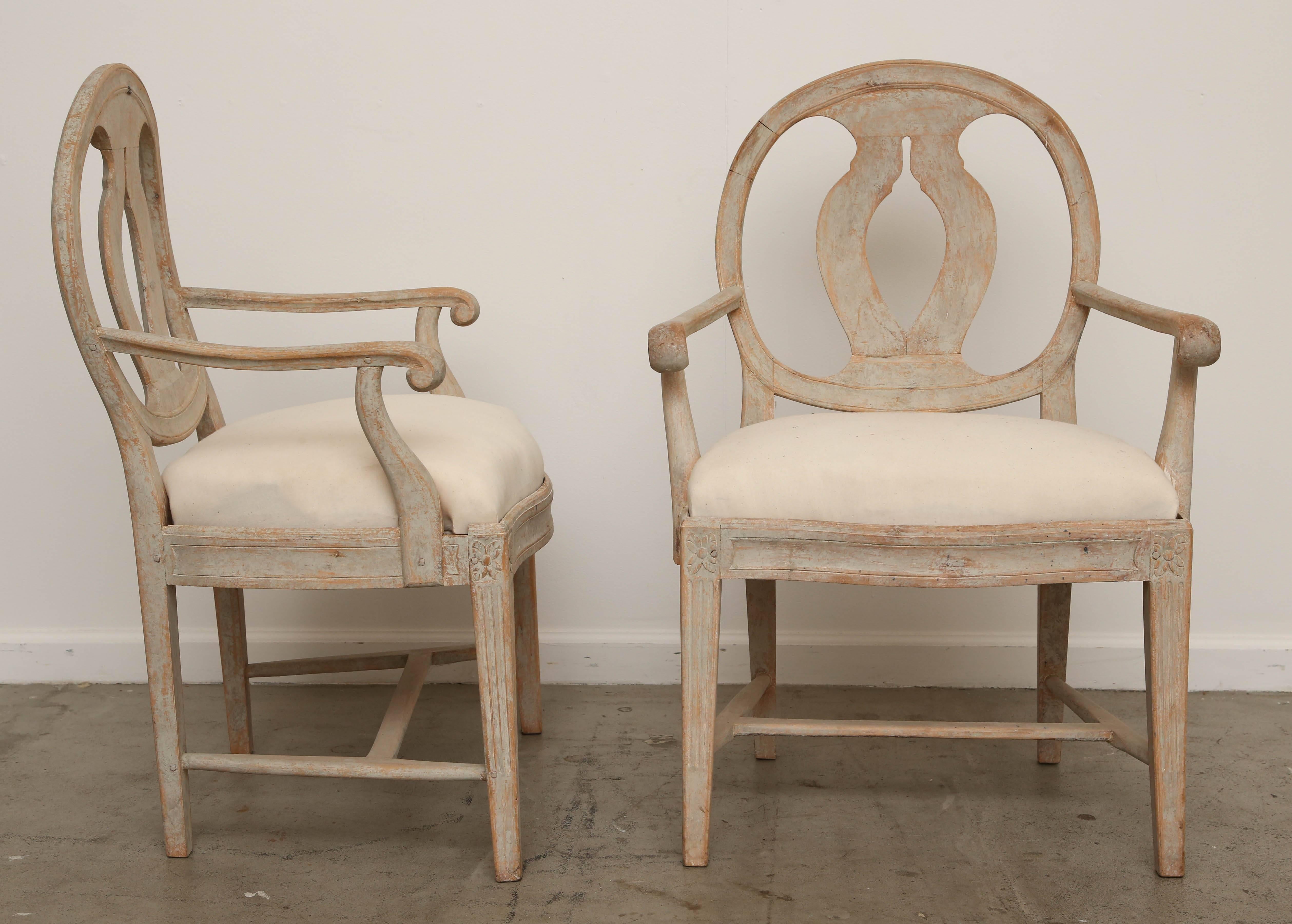 Pair of Antique Swedish late Gustavian armchairs, Classic urn-shaped curved
back splat. Curved and scrolled arms, top corner of legs have carved rosettes,
square fluted legs with cross stretchers. Dry scraped down to original paint
Mid-19th