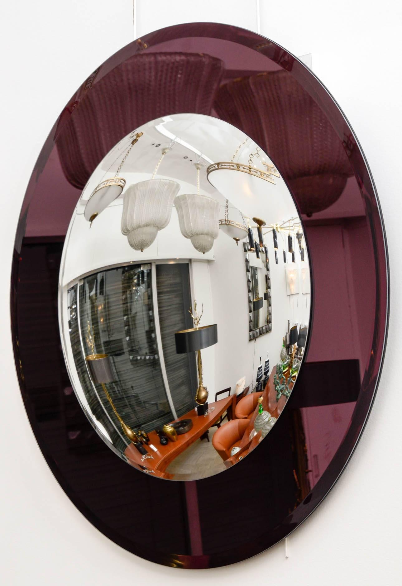Convex mirror.
Mauve circumference, mercury silvering.
Contemporary design.