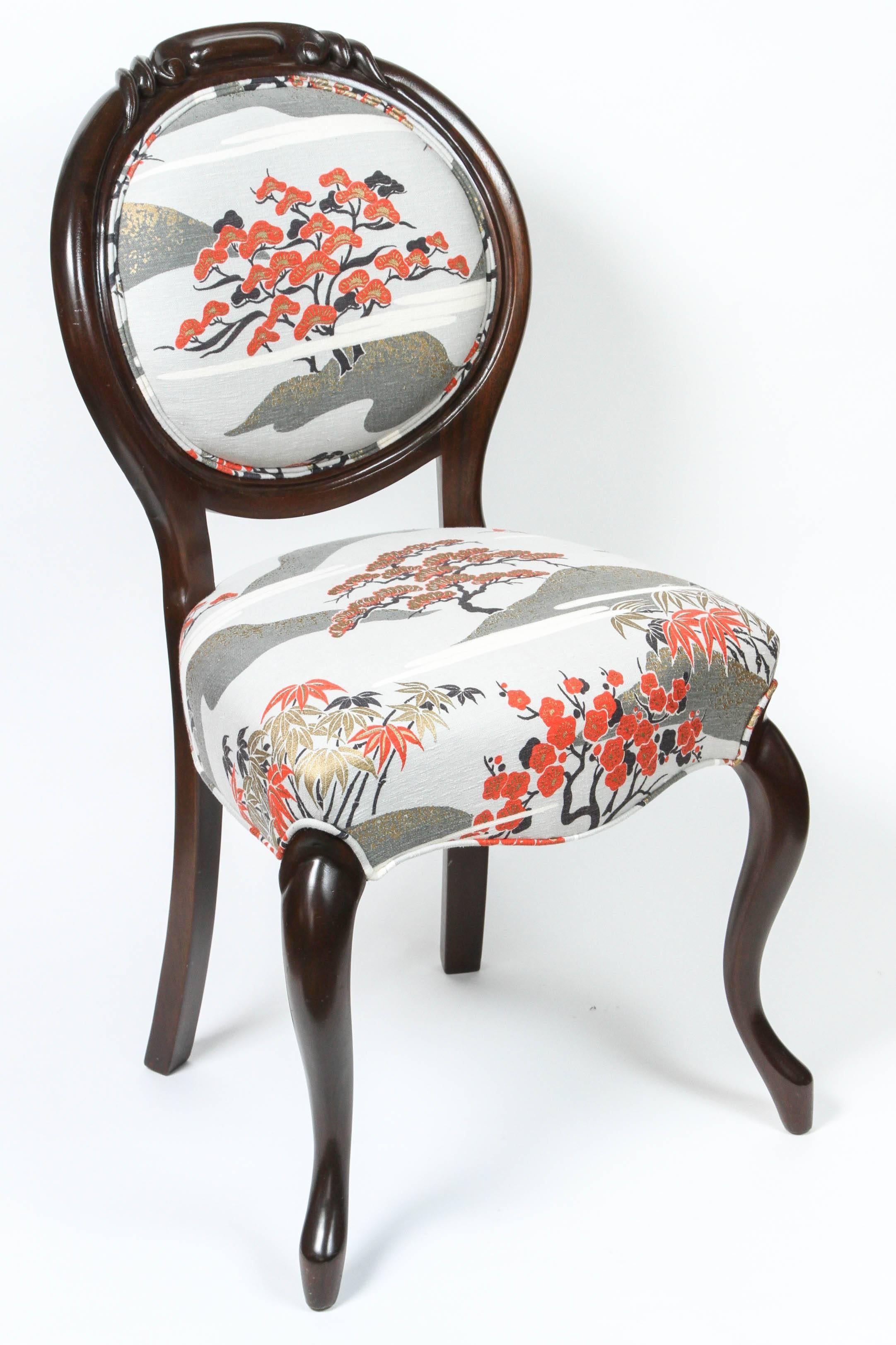 Newly refinished walnut framed Victorian side chair upholstered in Japanese motif cotton fabric.