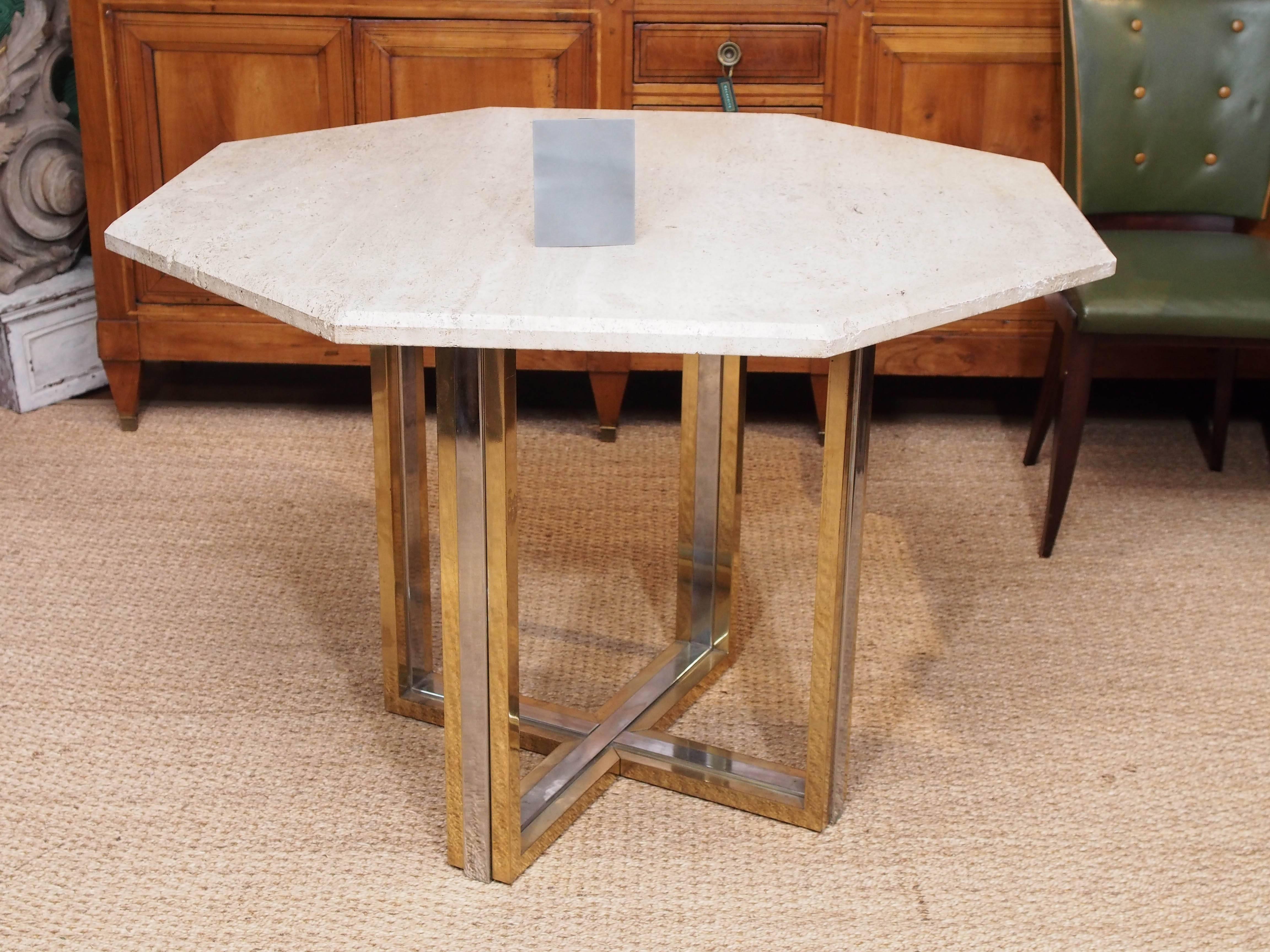 A modern but extremely versatile travertine tabletop with a brass and chrome base from Italian designer Willy Rizzo.