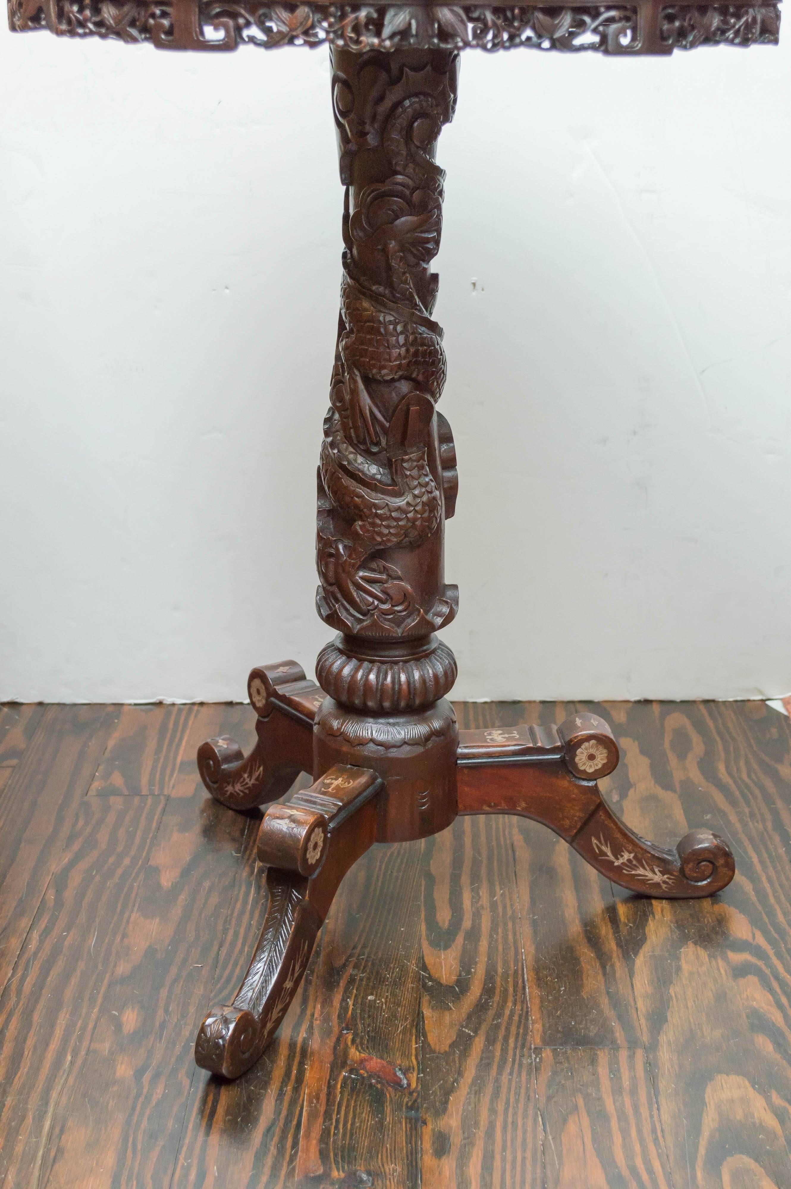 19th century Anglo-Chinese carved teak and inlaid stand, circa 1880
From the China Trade, clipper ship, period. Very in vogue and exotic decor popular in Europe and America in the late 19th century. Ornately carved and inlaid decoration. Boxwood