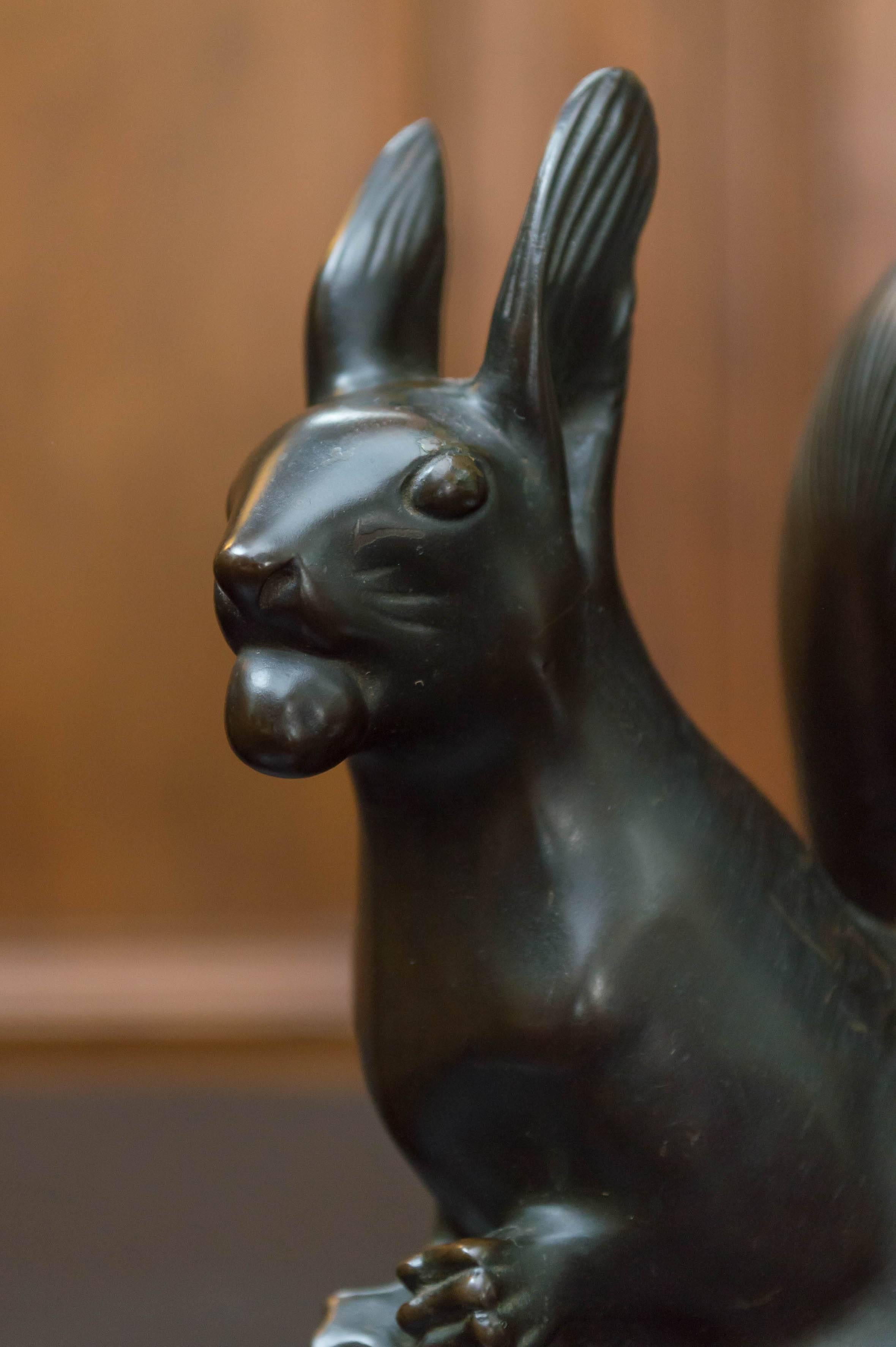 An animated pair of Austrian Art Deco bronze squirrel bookends, circa 1925.
Both with Austrian foundry marka and signed by F Gruber. The foundry mark is a triangle with an M inside and the letters A, E, G on the outside points of the triangle with