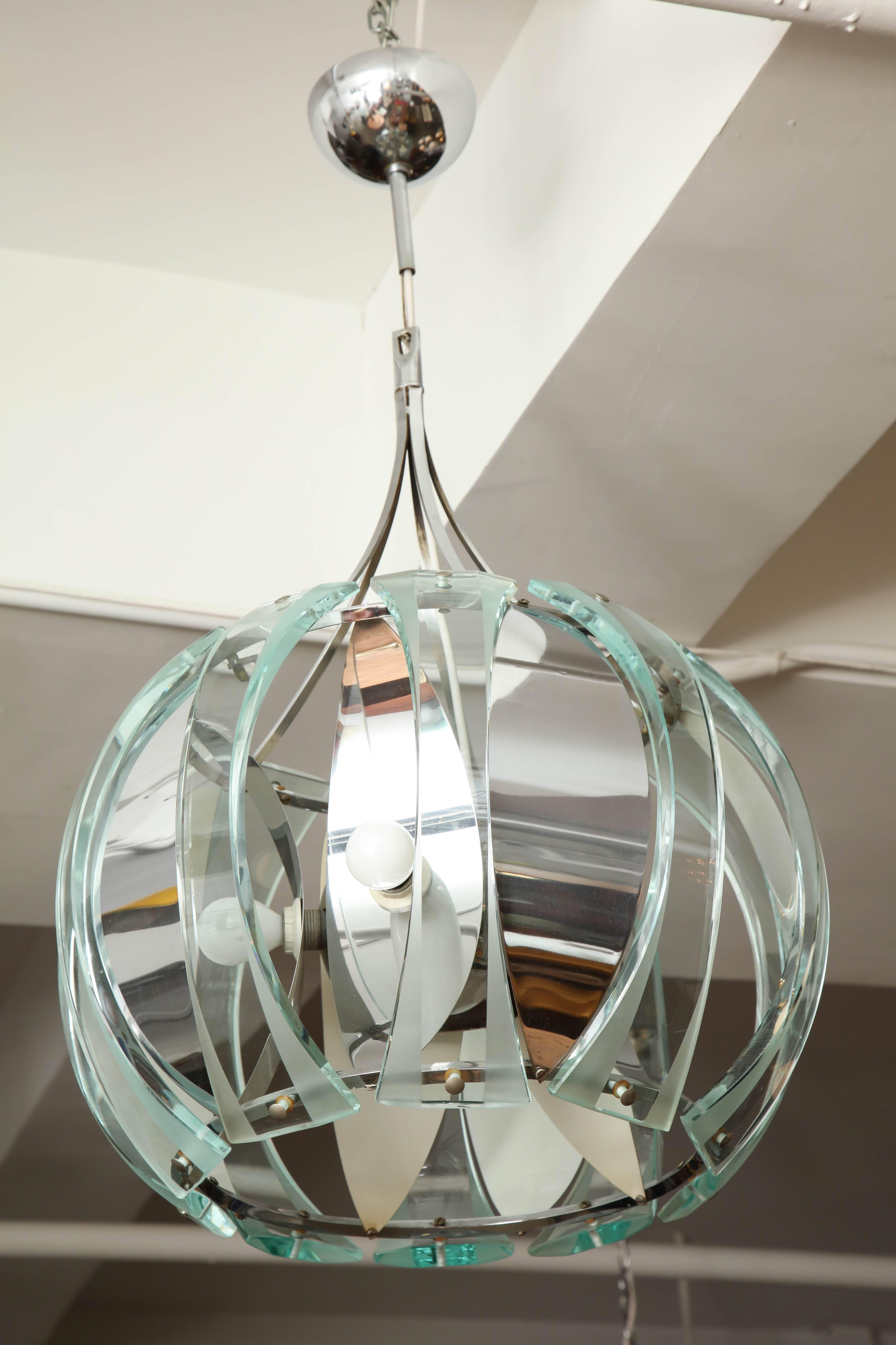 Pendant or chandelier made in Milan, 1970, unusual large stunning lite with ten curved, cut and acid etched glass panels on a chrome with white lacquer frame, great quality. Takes five e14 and one incandescent bulbs, length can be easy adjusted to