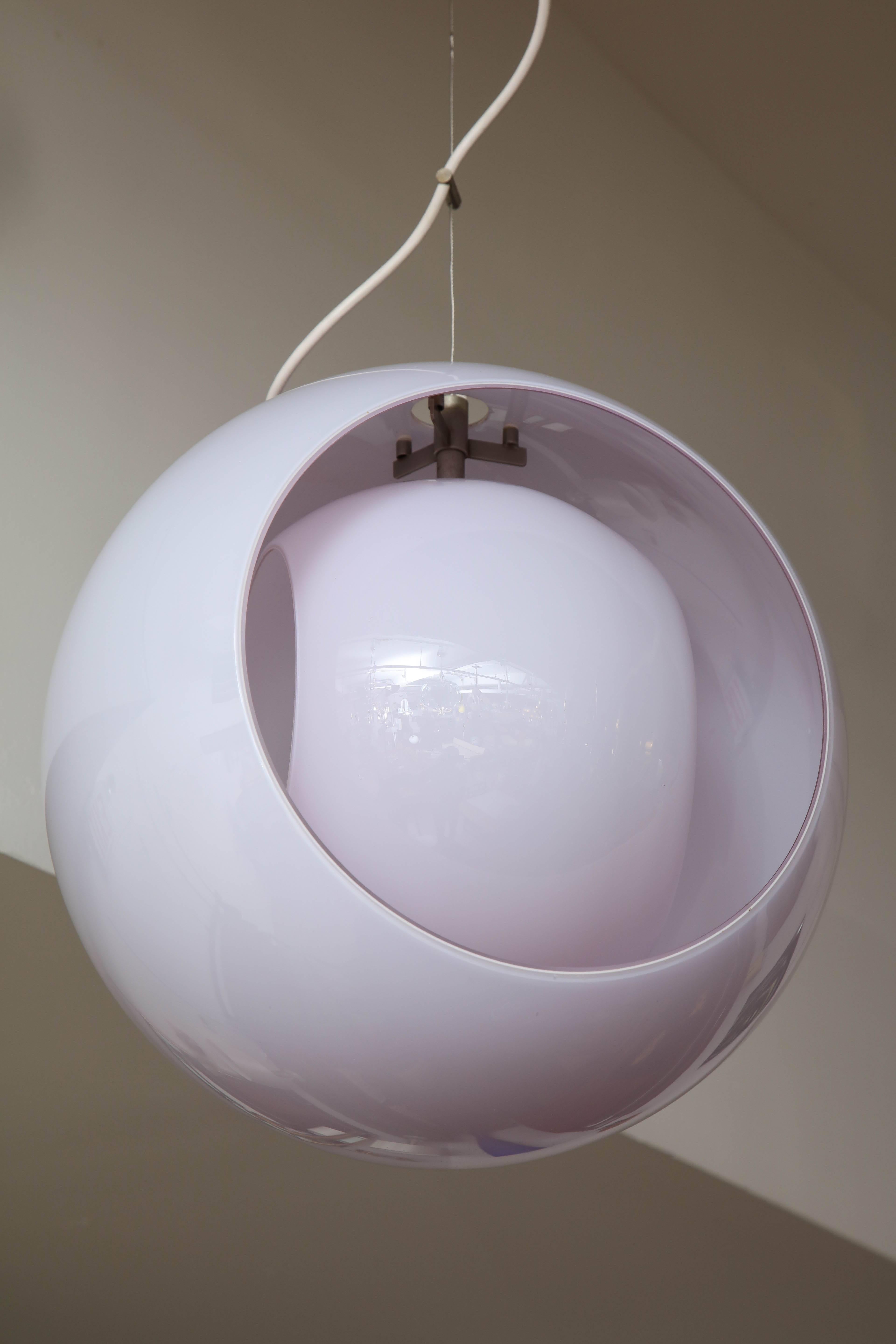 Modernest pendant light designed by Gino Vistosi in a mauve color cased glass, inner glass shade turns so that you can change the bulb with ease. Made in Venice in 1960.
Unfortunately the color in the photo doesn't do it justice, as you can see from