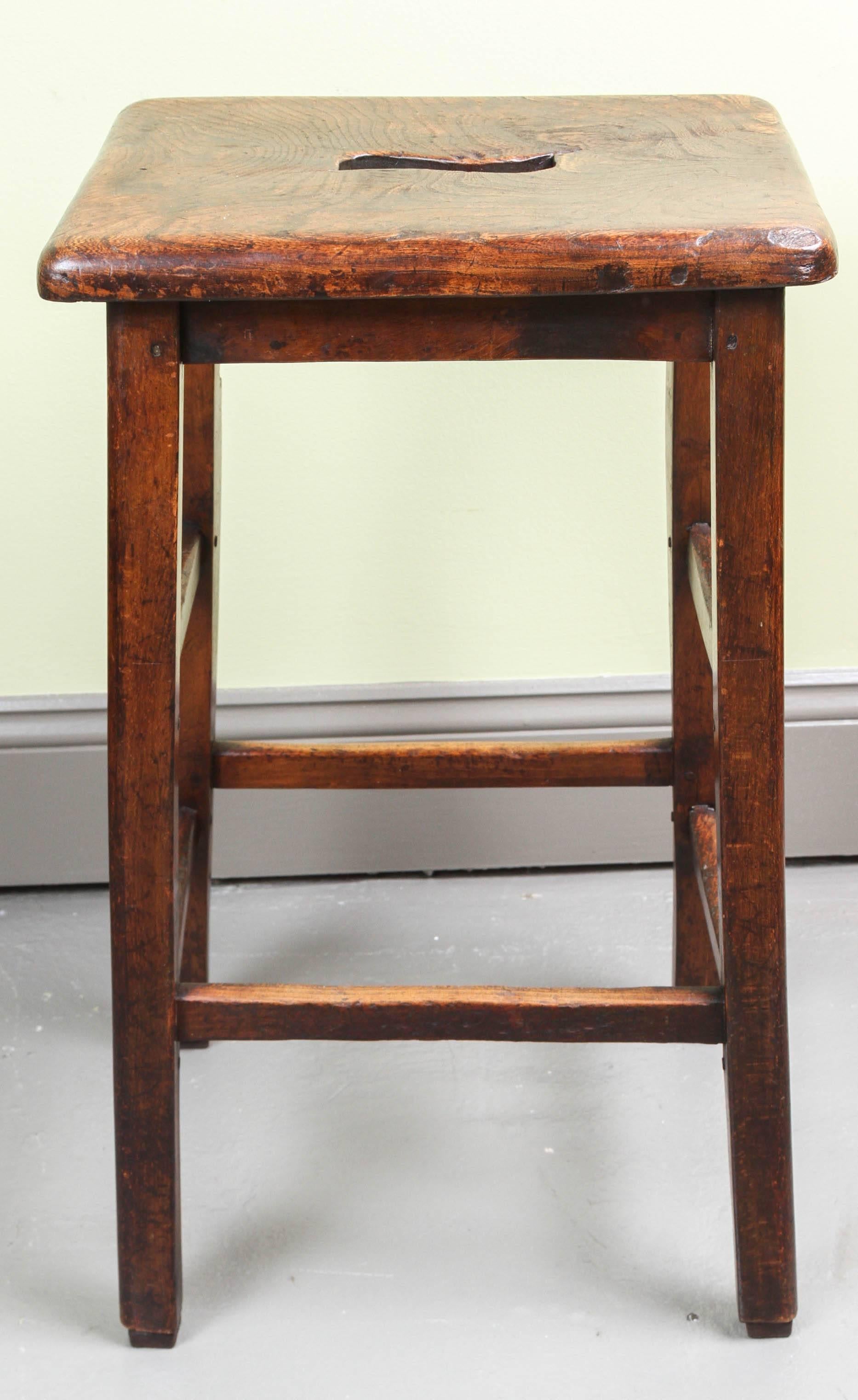 English oak and elm stool with cut out detail in center of seat, circa 1870.

 

