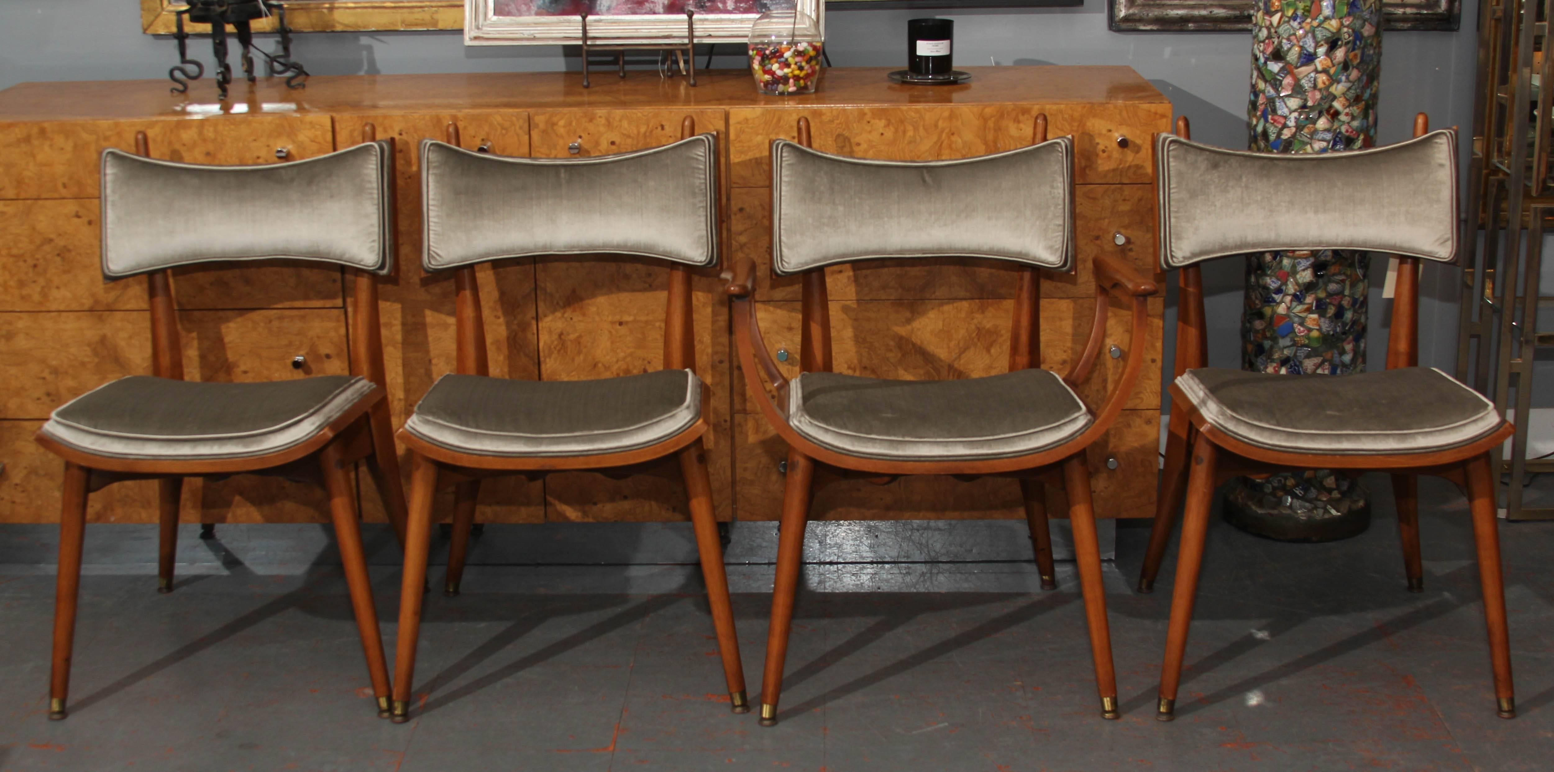 Great set of four wood frame chairs in pearl grey silk velvet. One armchair, three armless. Comfortable with great lines, perfect for dining or as side chairs. Handsome from every angle.