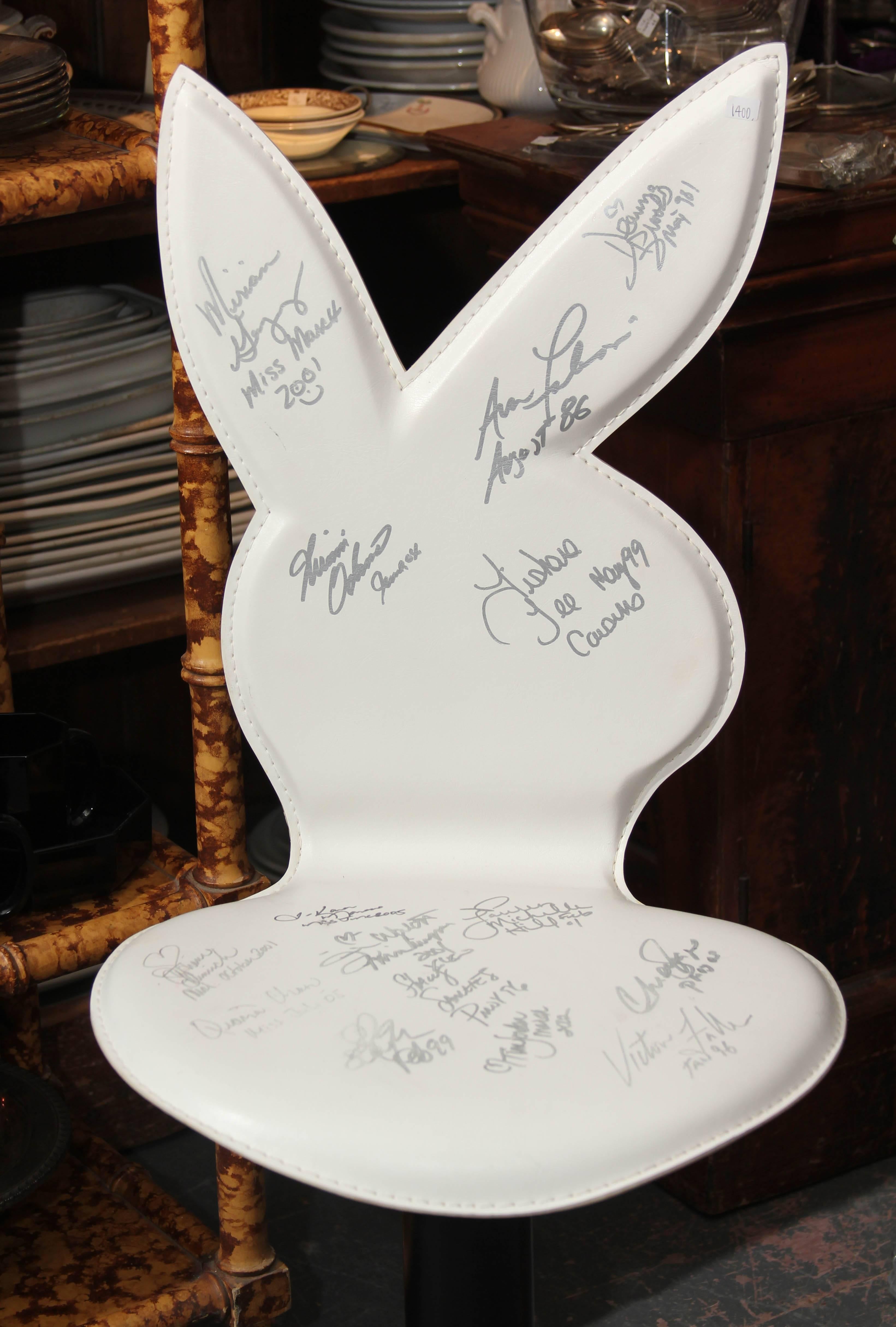 Fun swivel bar stool or chair signed by assorted playboy bunnies from 1986-2005.