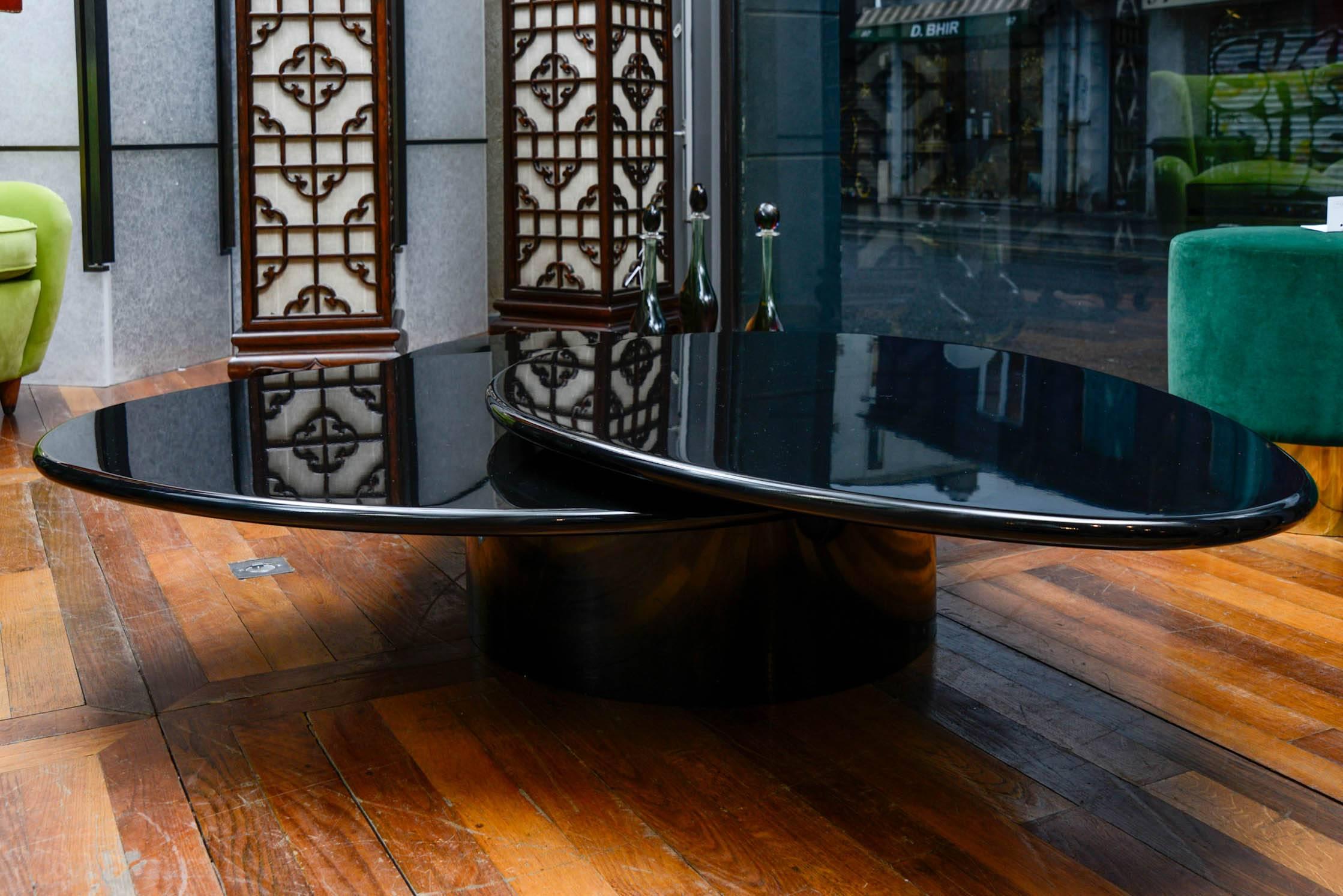 Black lacquered low table with three tops by Rougier.
