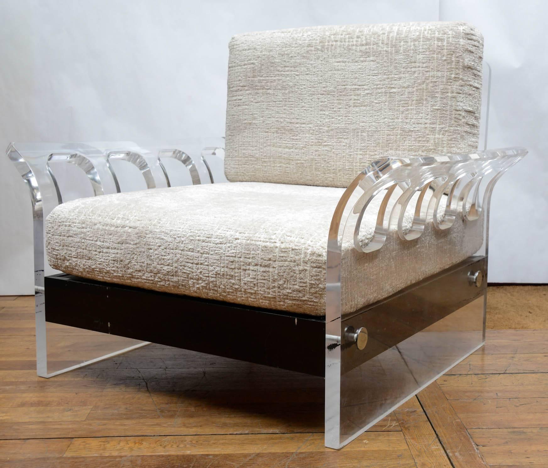 Plexiglass armchair, back and seat upholstered with ecru fabric.