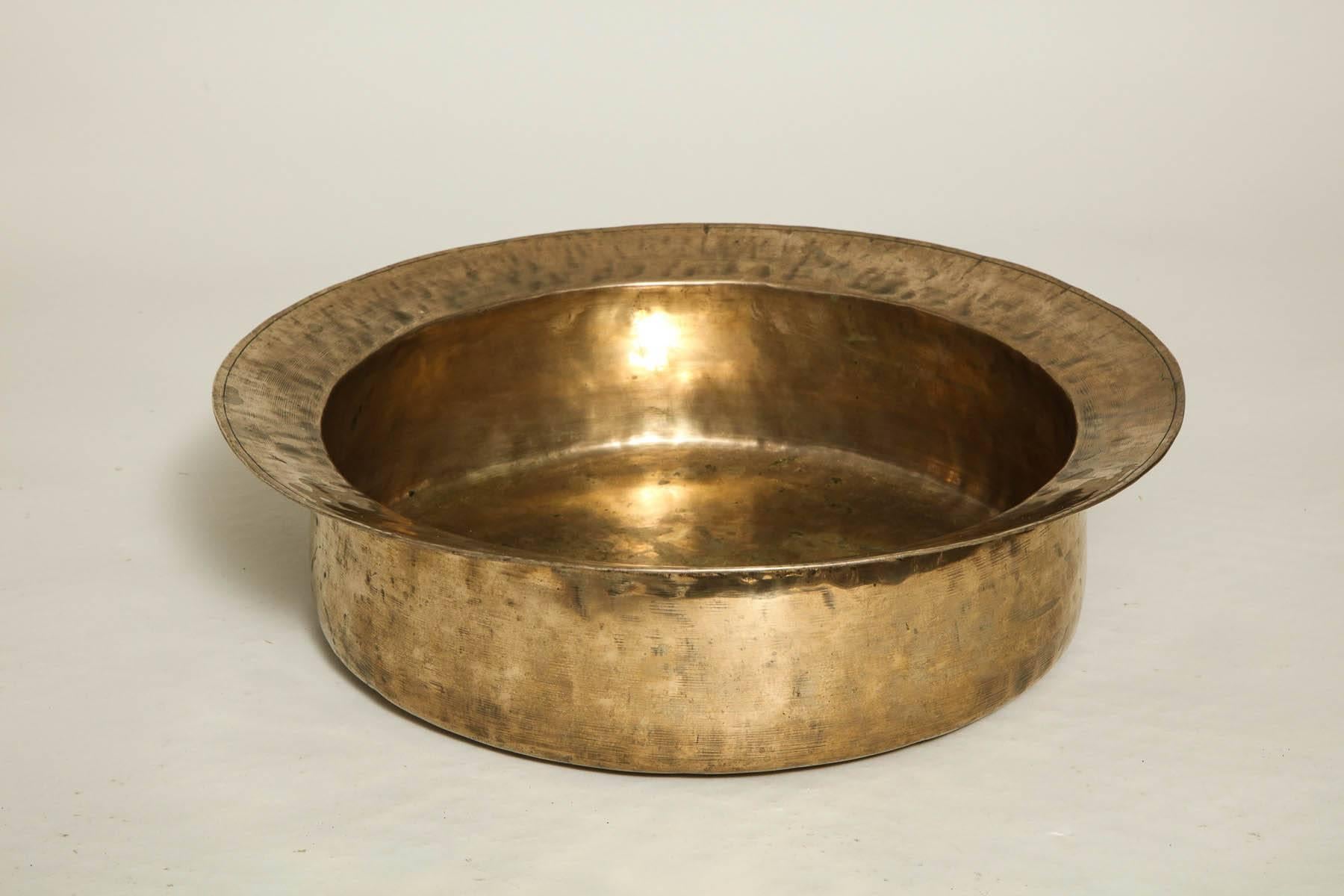 Fine 18th century English spun and hammered brass dairy bowl with rolled edge, deep basin and lovely surface.