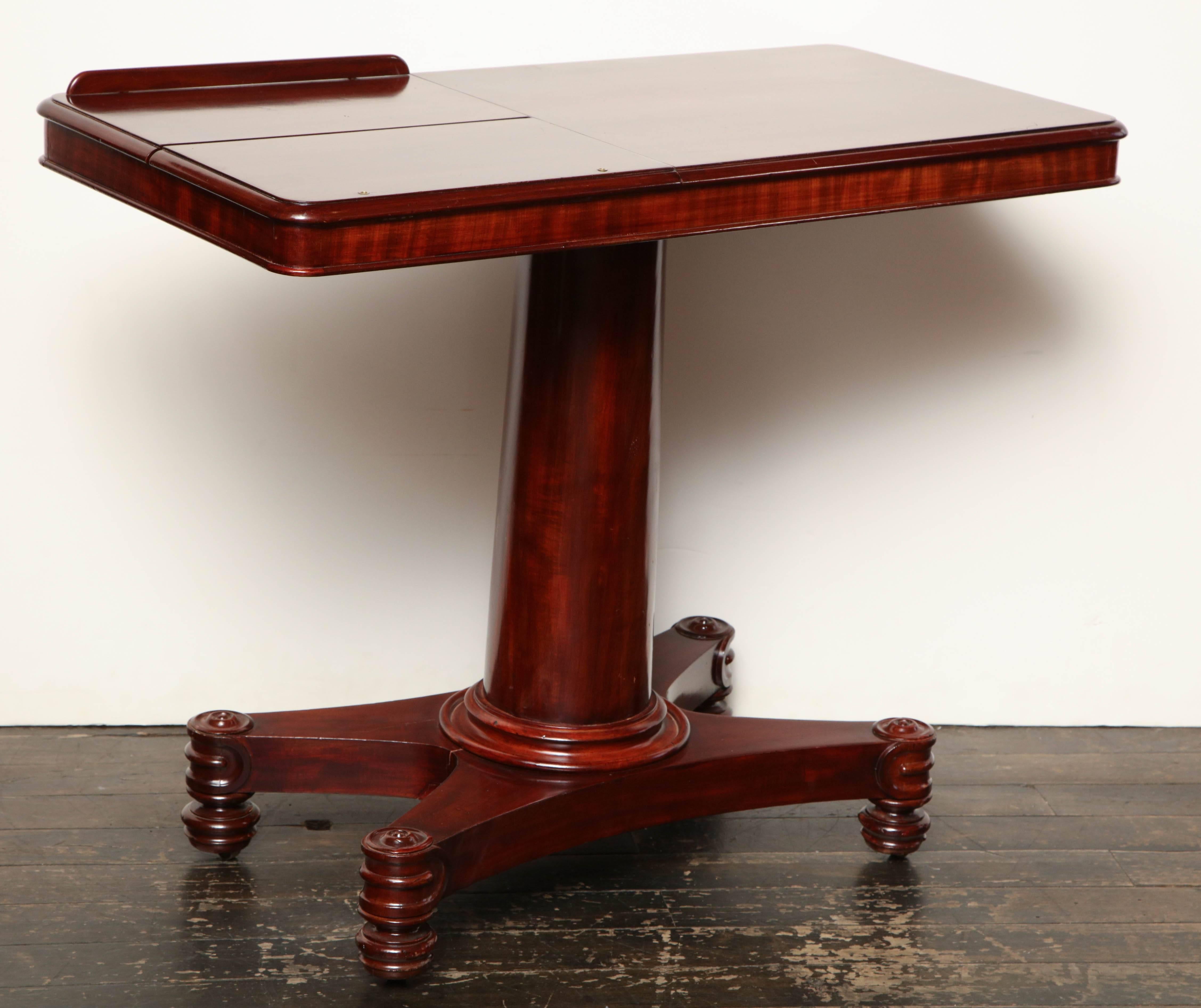 Early 19th century English adjustable bed table in mahogany.
It extends up to 11 inches from lowest position
and slides 8 inches to the left.