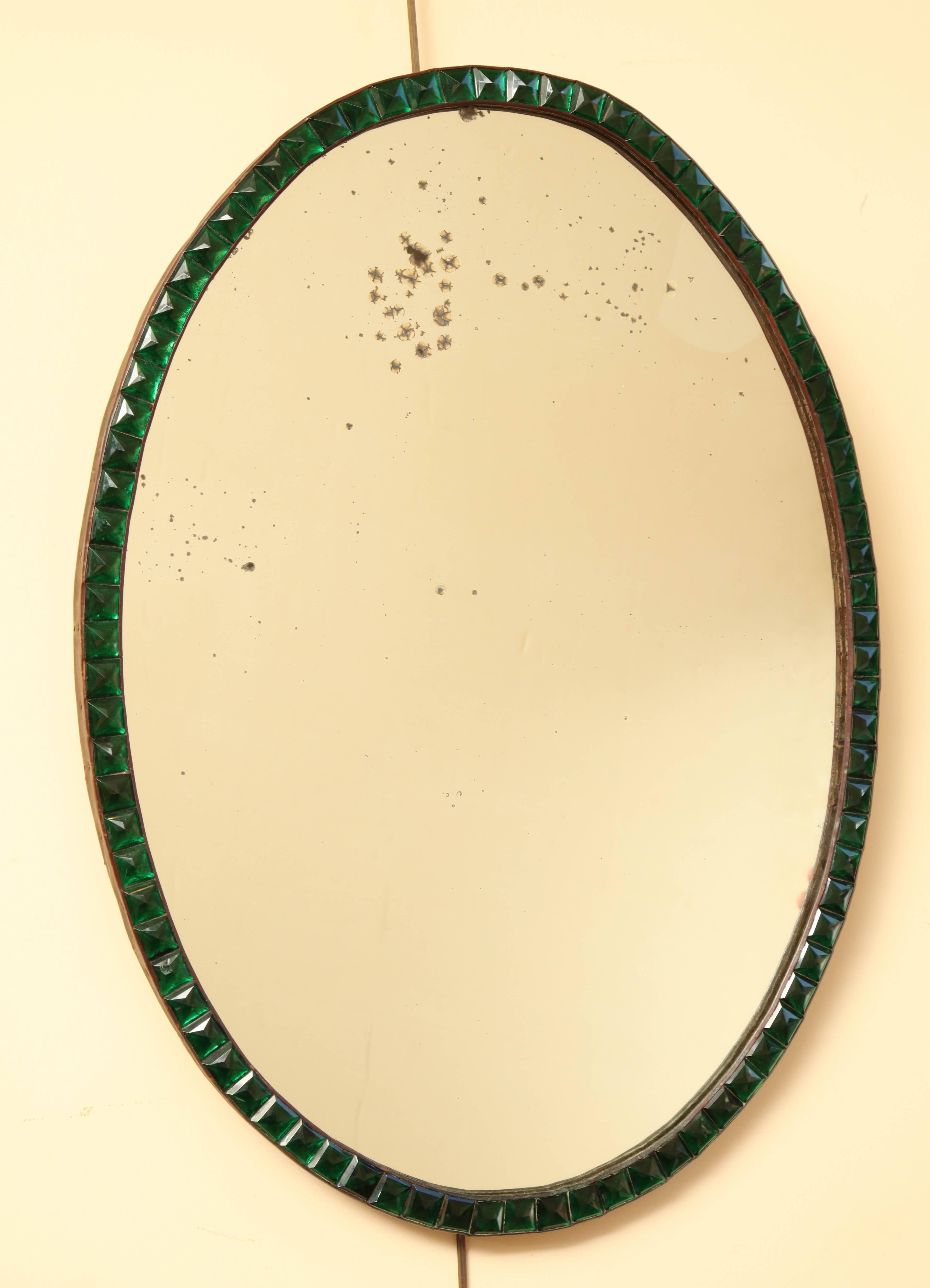 Very rare early 19th century Irish, green lozenge mirror with original looking oval glass.