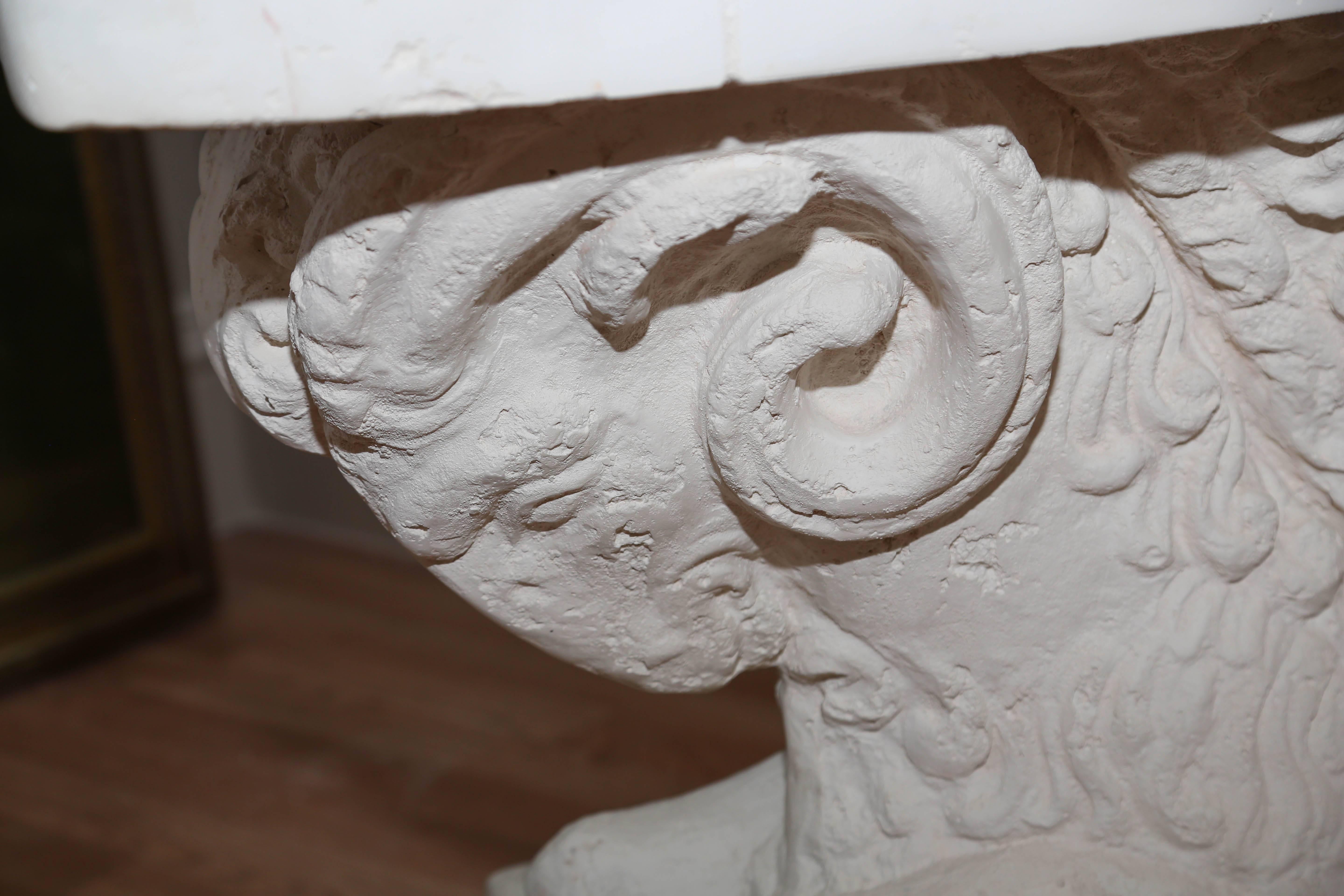 Striking faux stone ram's head table base. Could also be used as a console or sofa table.