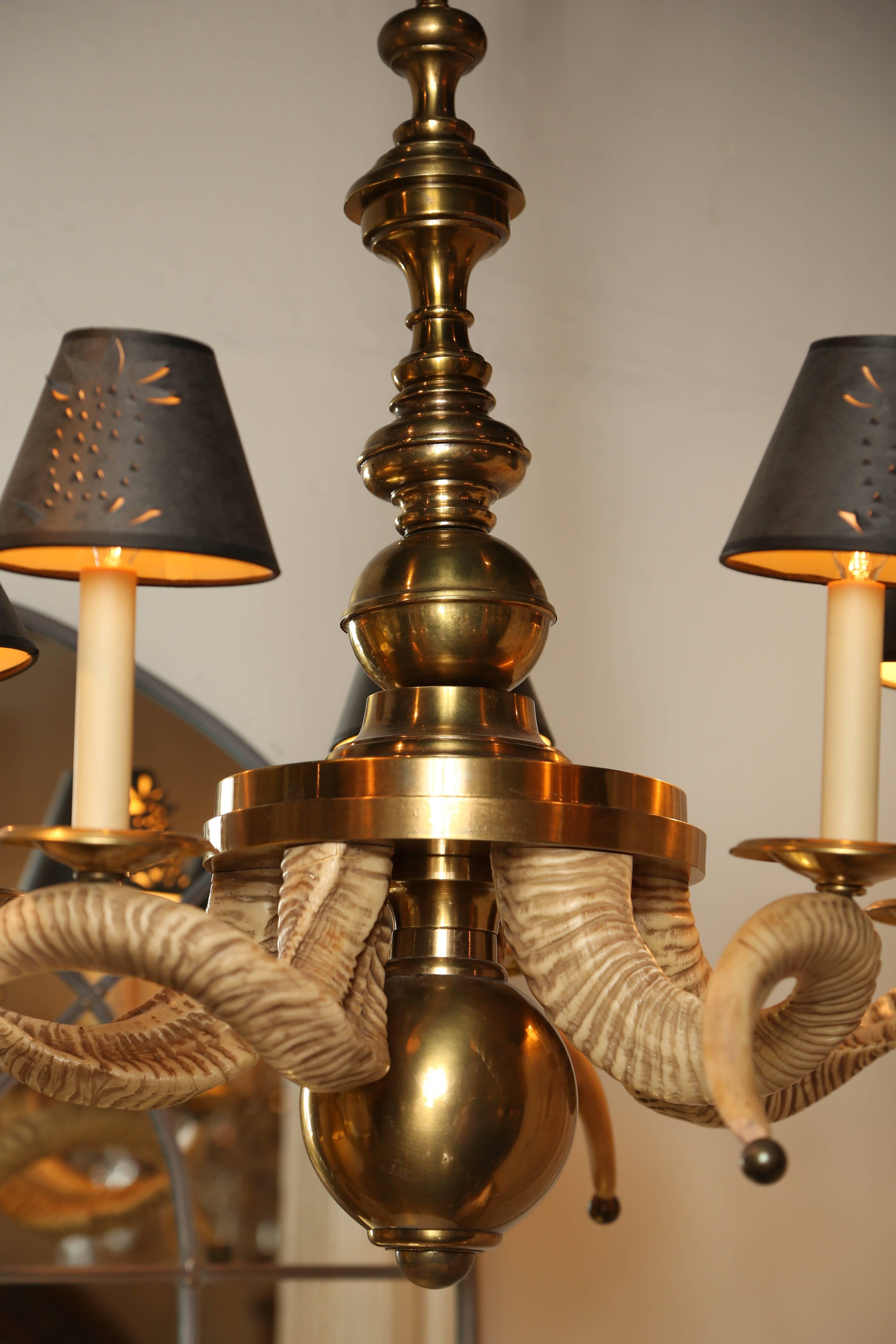 Striking vintage brass and faux horn five-arm chandelier.