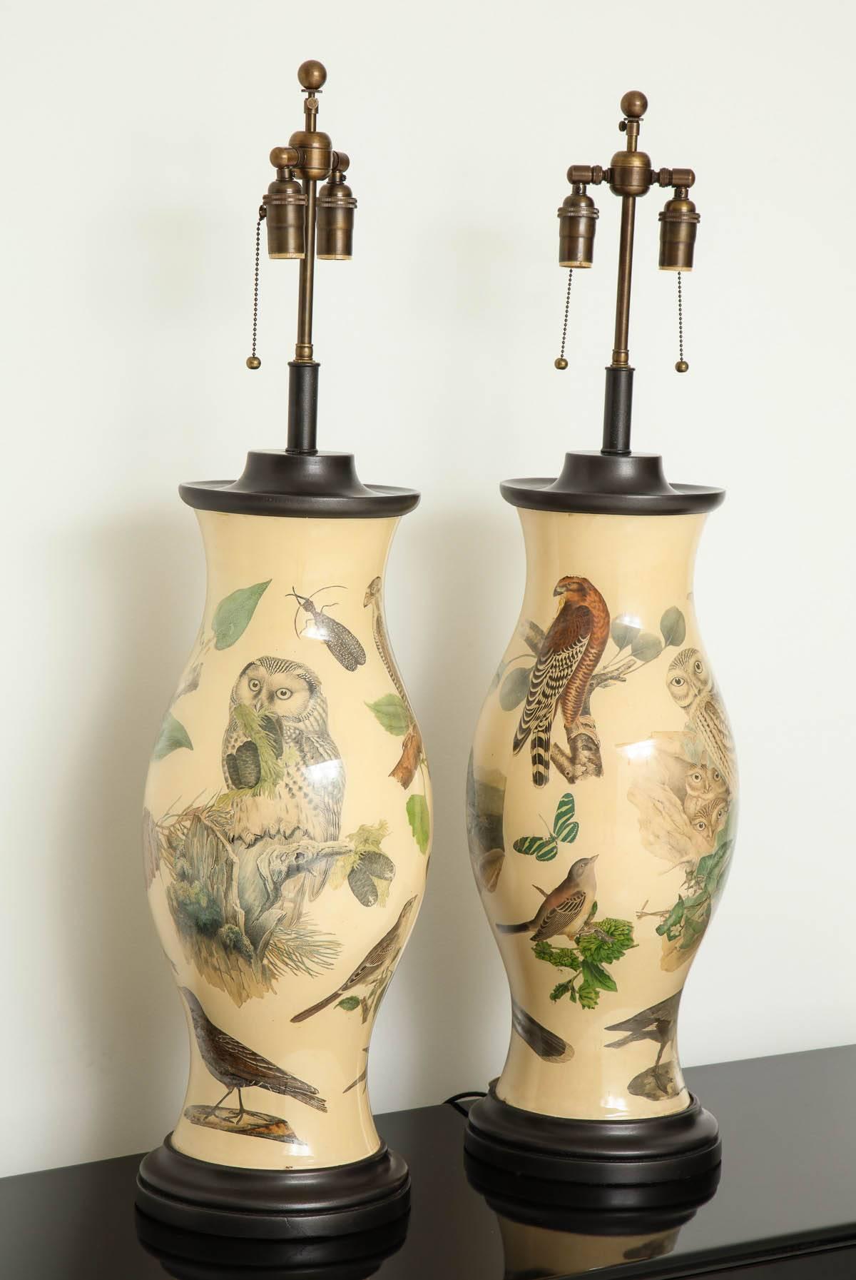 Stunning pair of Large decoupage lamps.
The inside surface of the glass lamps have been  beautifully decorated with wildlife decals which are applied on a lovely soft tan background.
The lamps have been Newly rewired with   Antique bronze double