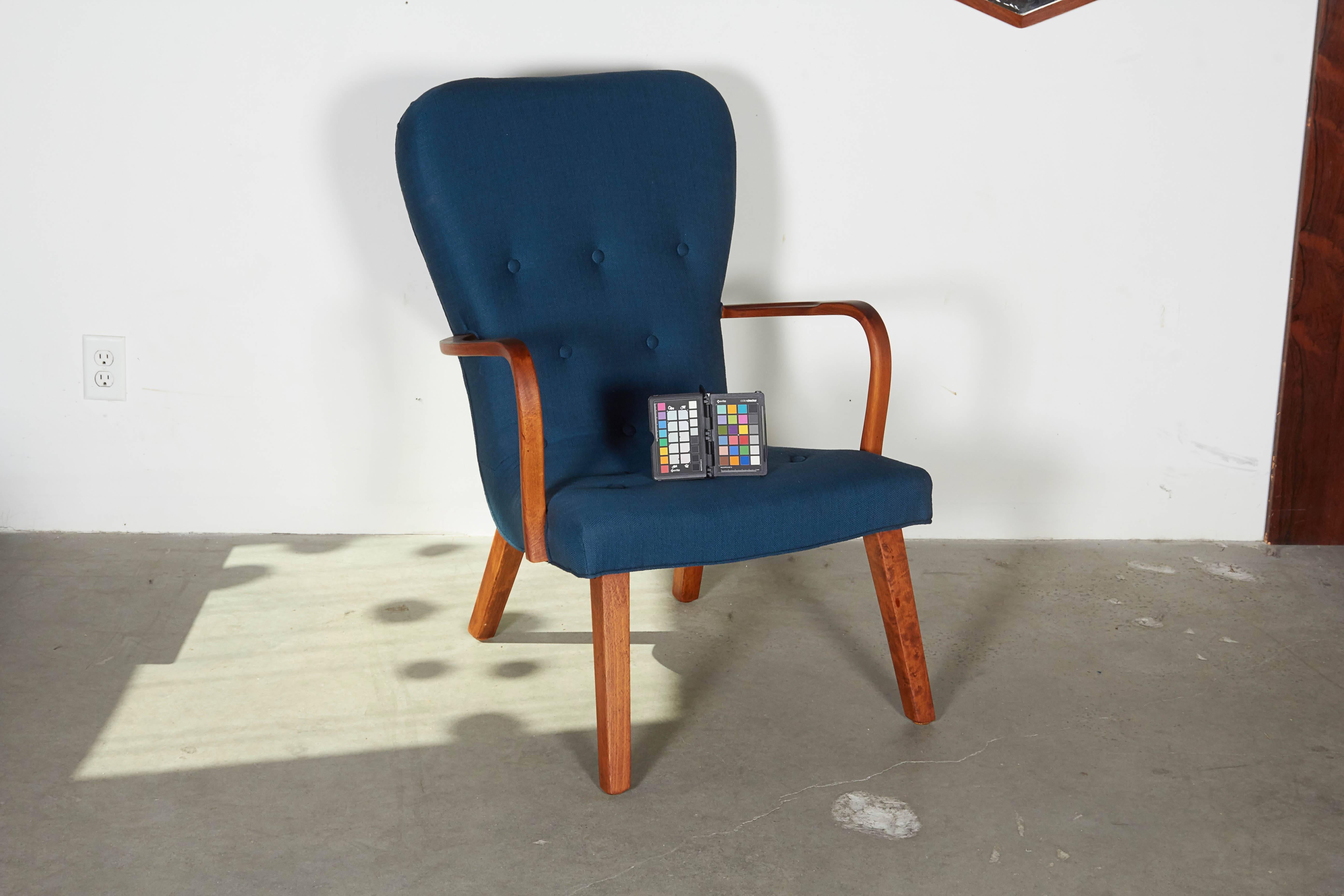 Vintage 1940s Teak Wingback 

This Scandinavian Armchair is in excellent condition and is one of the most comfortable chairs you will ever sit in. We upholstered it in this navy blue fabric that was re-issued from the 1950s. Ready for pick up,