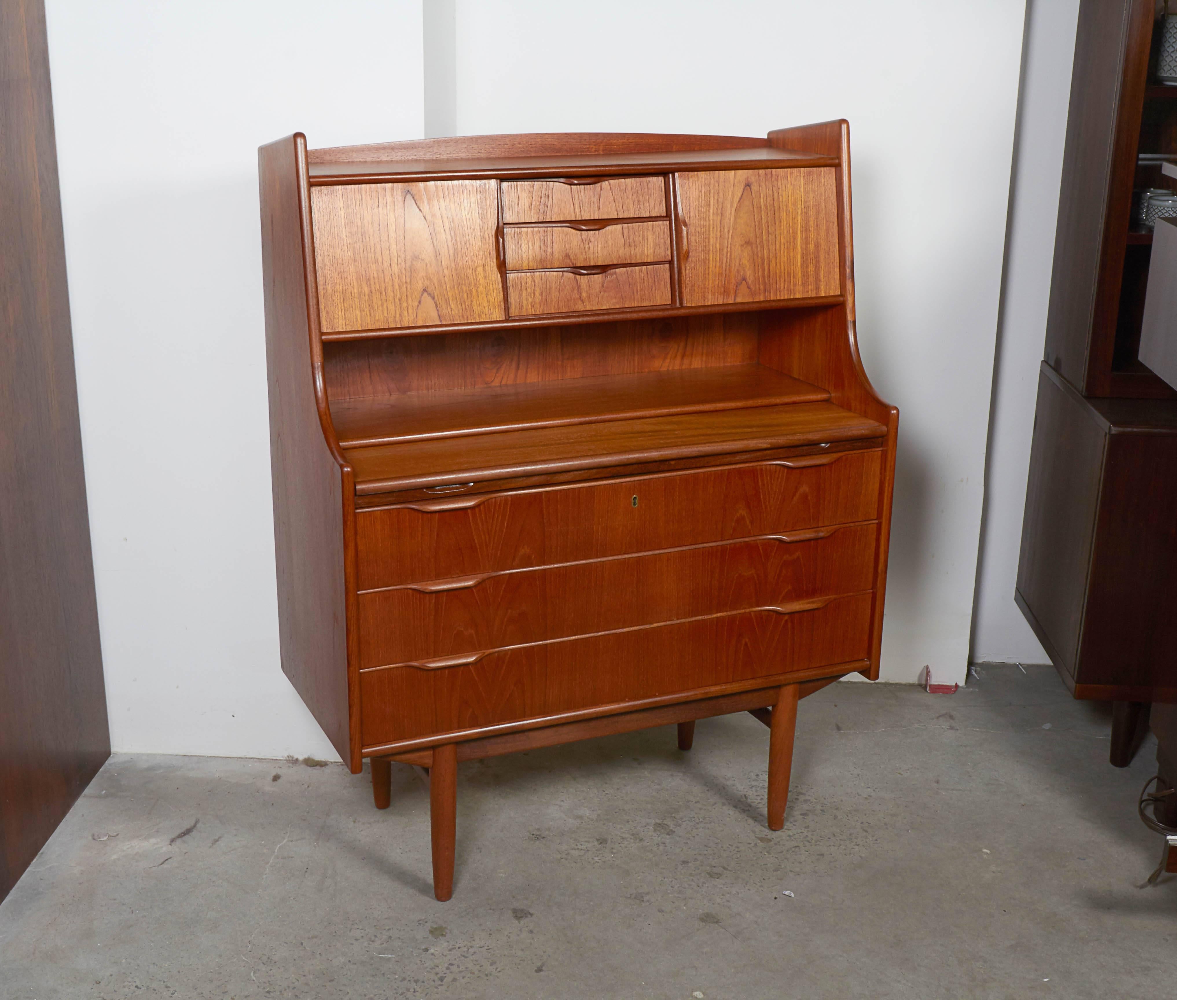 Vintage 1960s Danish Secretary Desk & Dresser

Excellent for use in a bedroom or guest room. The drawers are dresser size and the desk is a big added bonus. Small enough for any room. The depth of the secretary when the desk is pulled out is