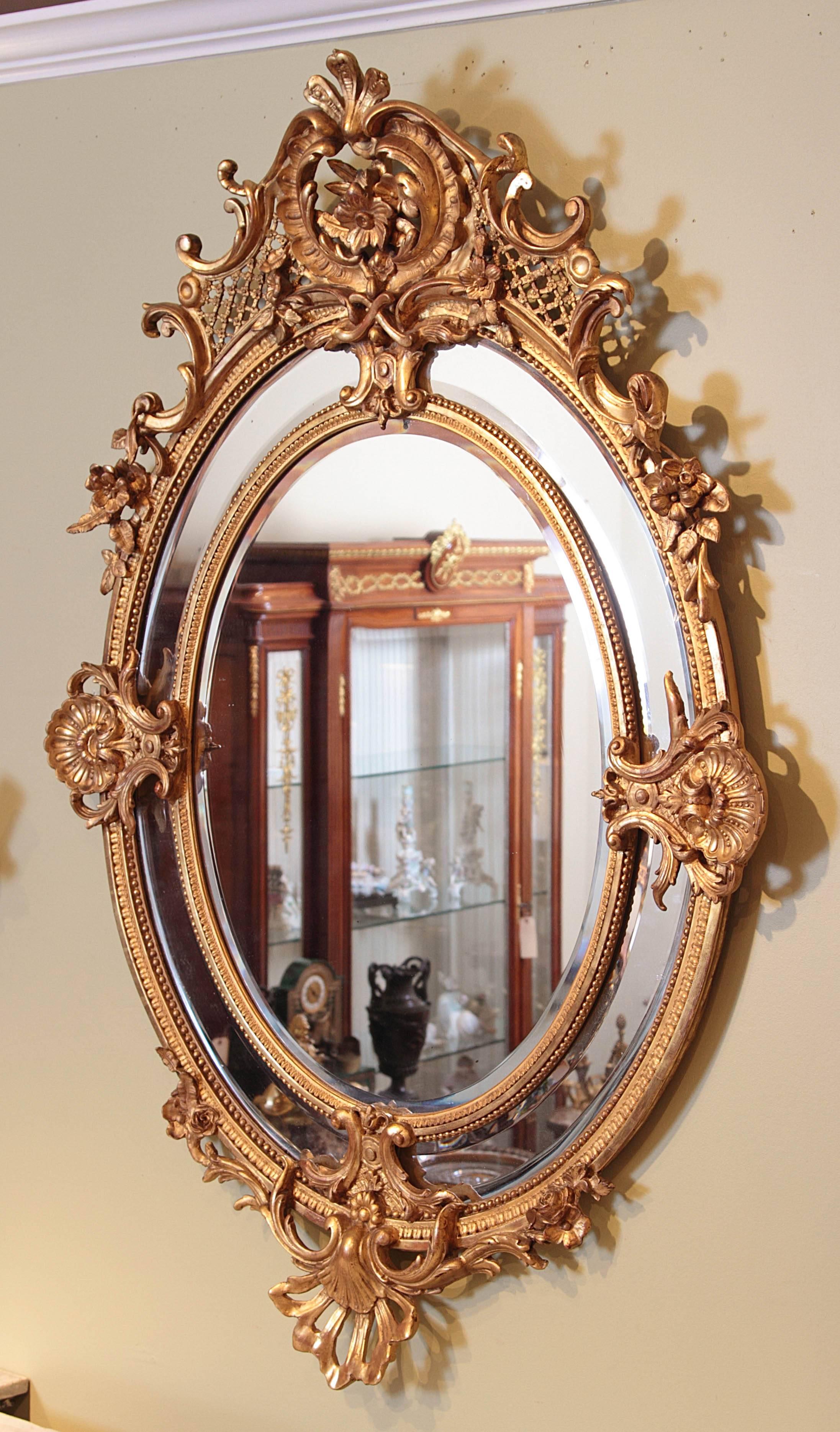 Beautiful 19th century French Louis XV gilt carved oval mirror.
