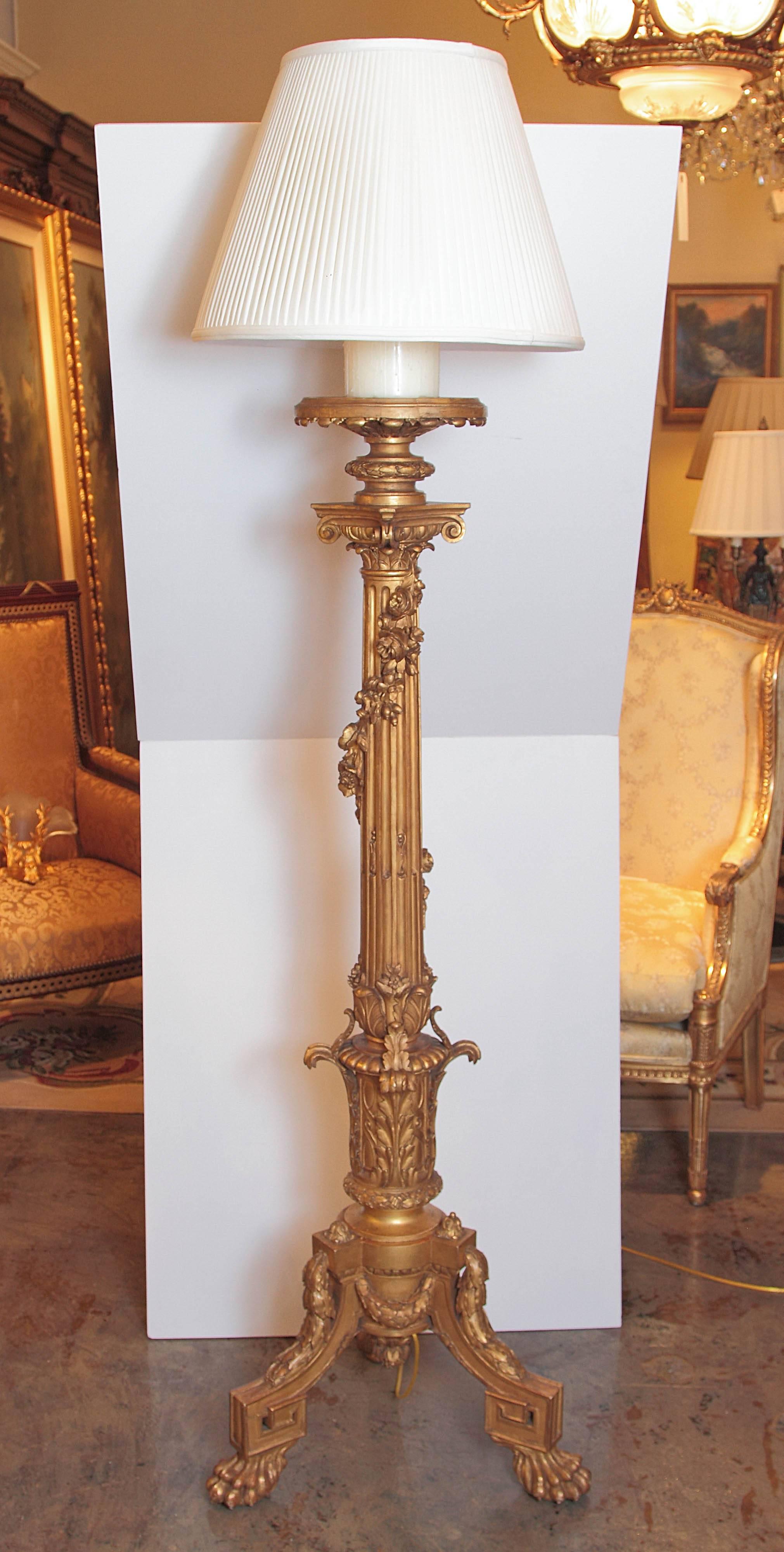 Pair of finely carved 19th century French gilt carved Regence torchieres made into floor lamps. Custom silk pleated shades.