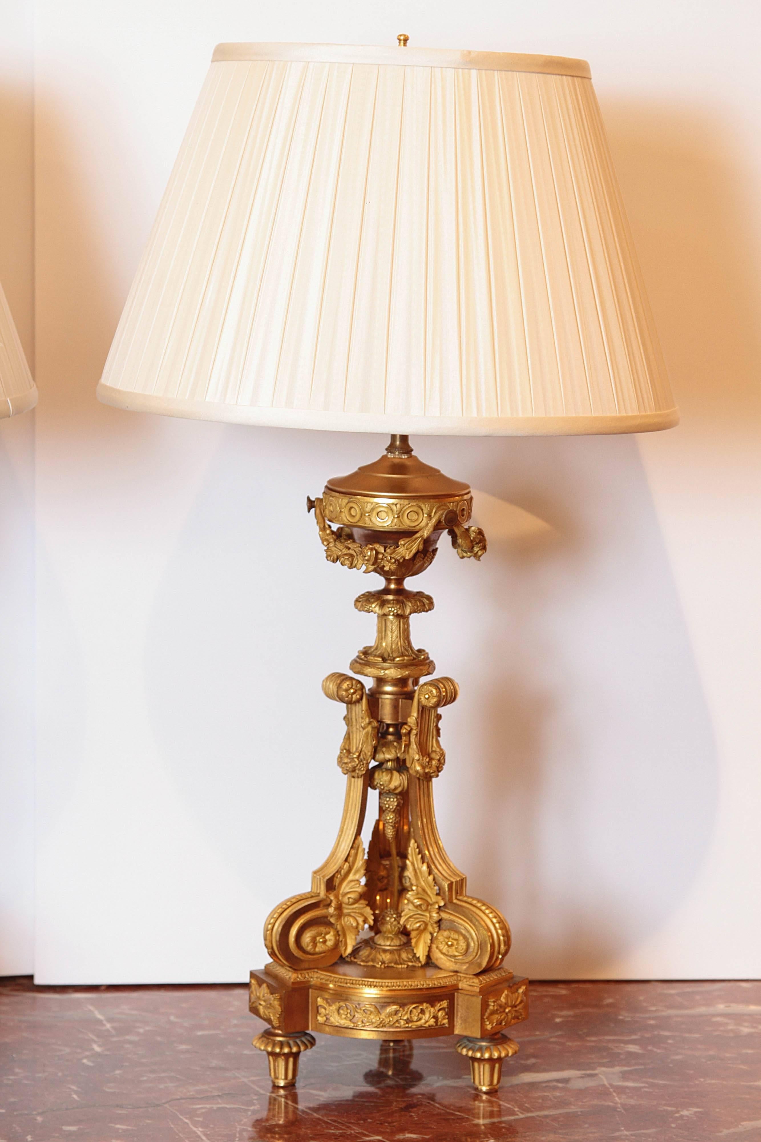 Pair of early 19th century finely cast gilt bronze Louis XVI candelabrum made into lamps.