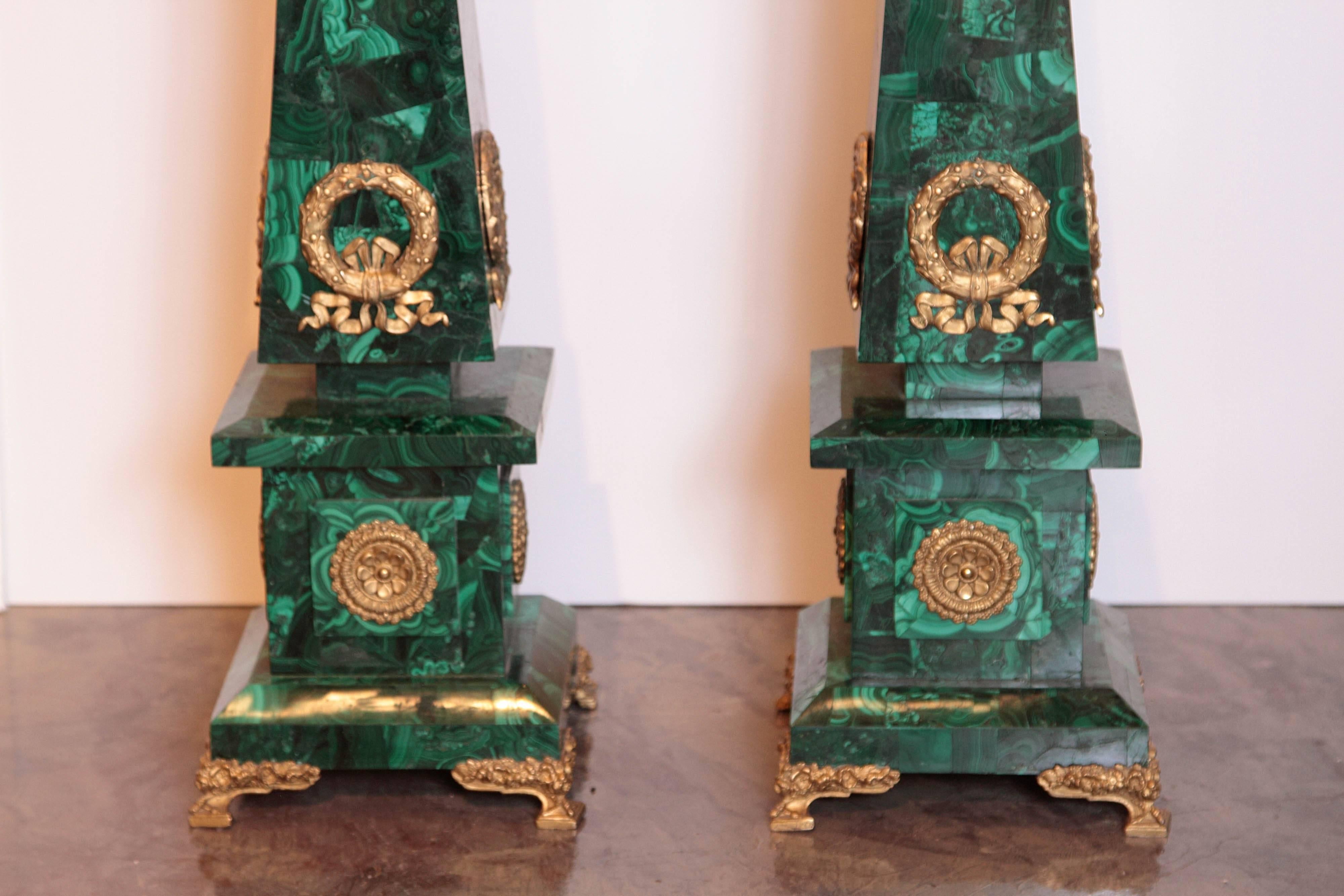 A fine pair of French Empire gilt bronze and malachite obelisks. Signed behind the bronzes P.E. Guerin. Excellent condition large size.