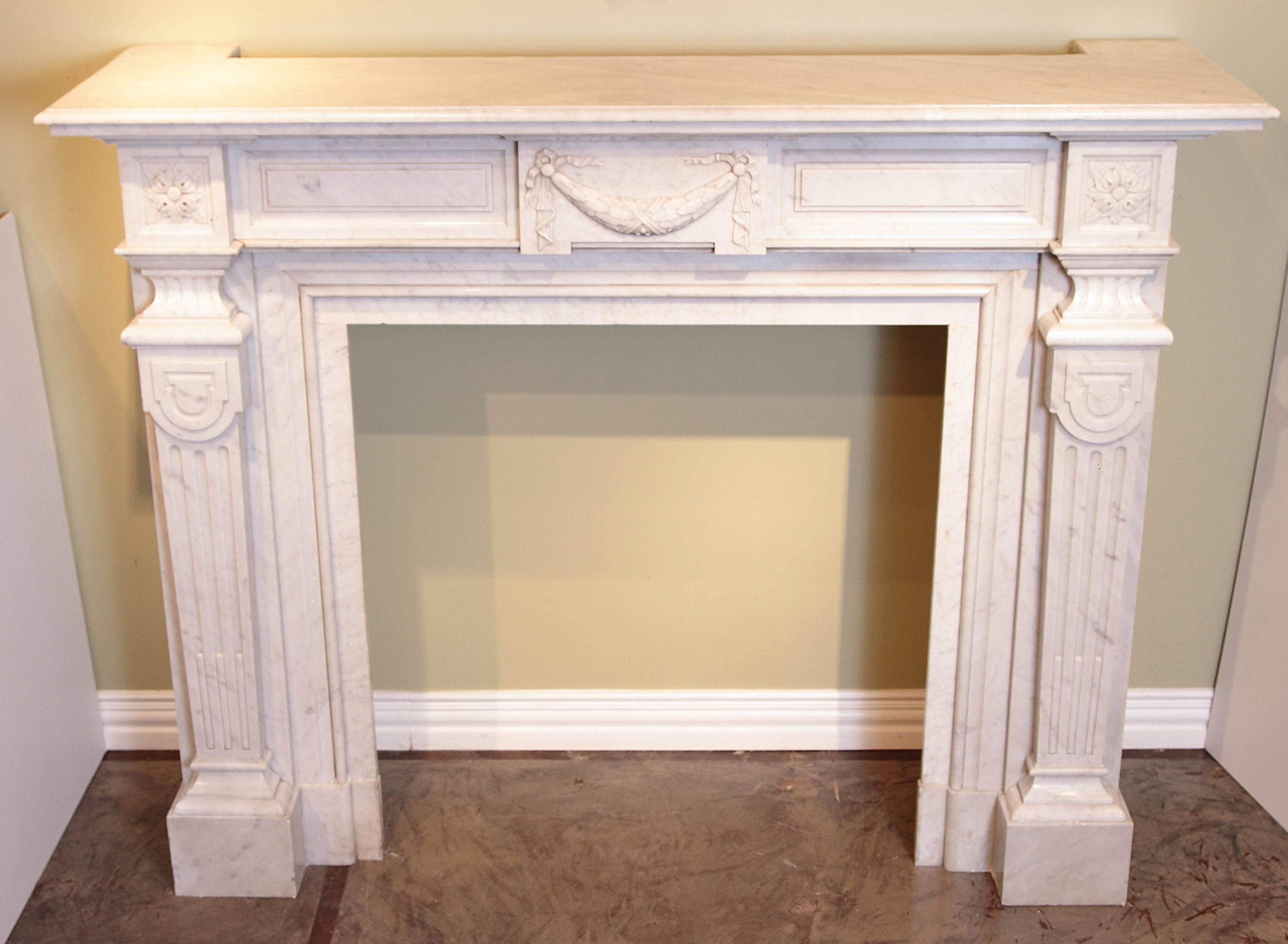 Beautifully carved and finely detailed 19th century Louis XVI Carrara marble mantel.