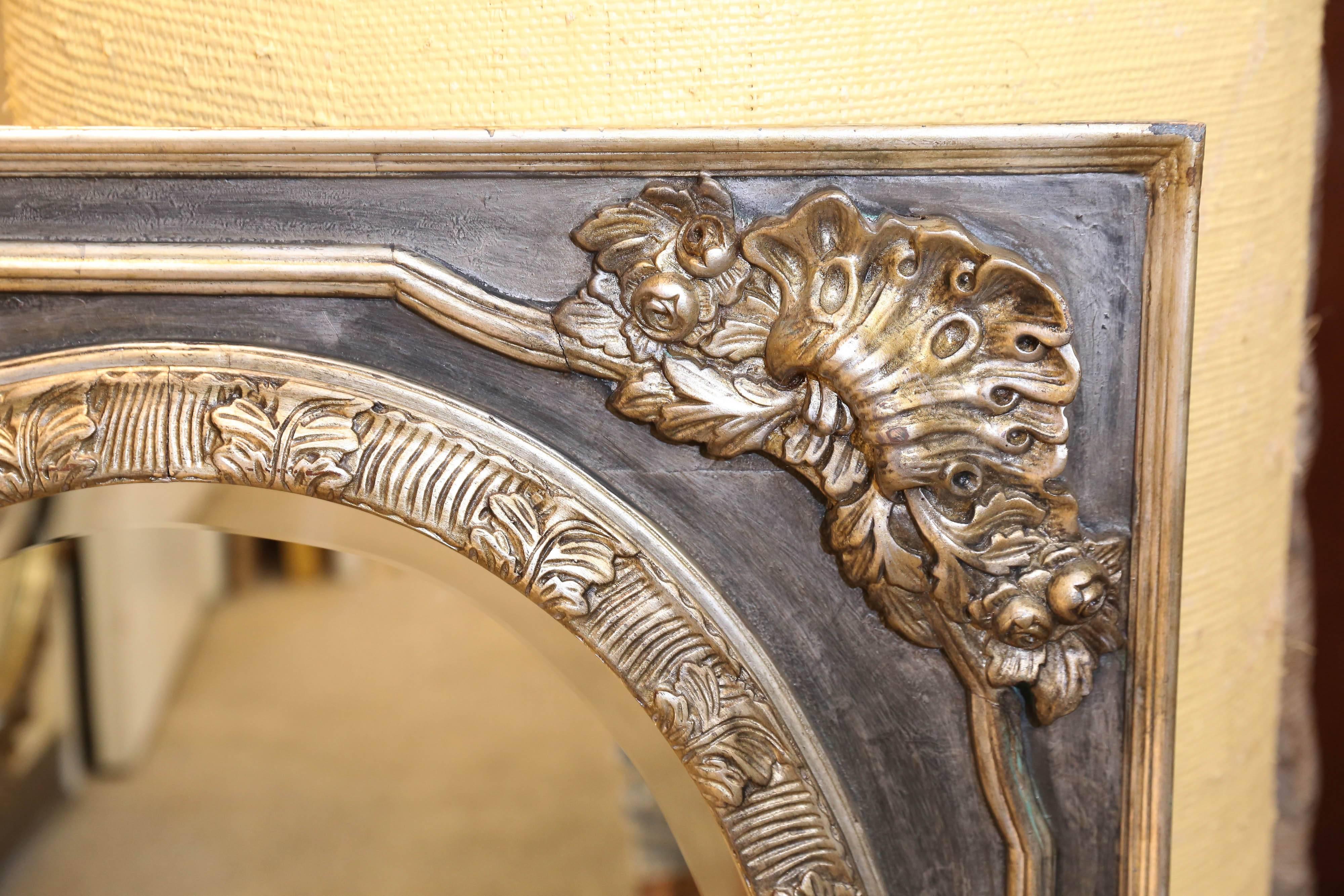 Pair of nicely detailed wood framed mirrors that are painted gray and
Have silver highlighted carved embellishments.
