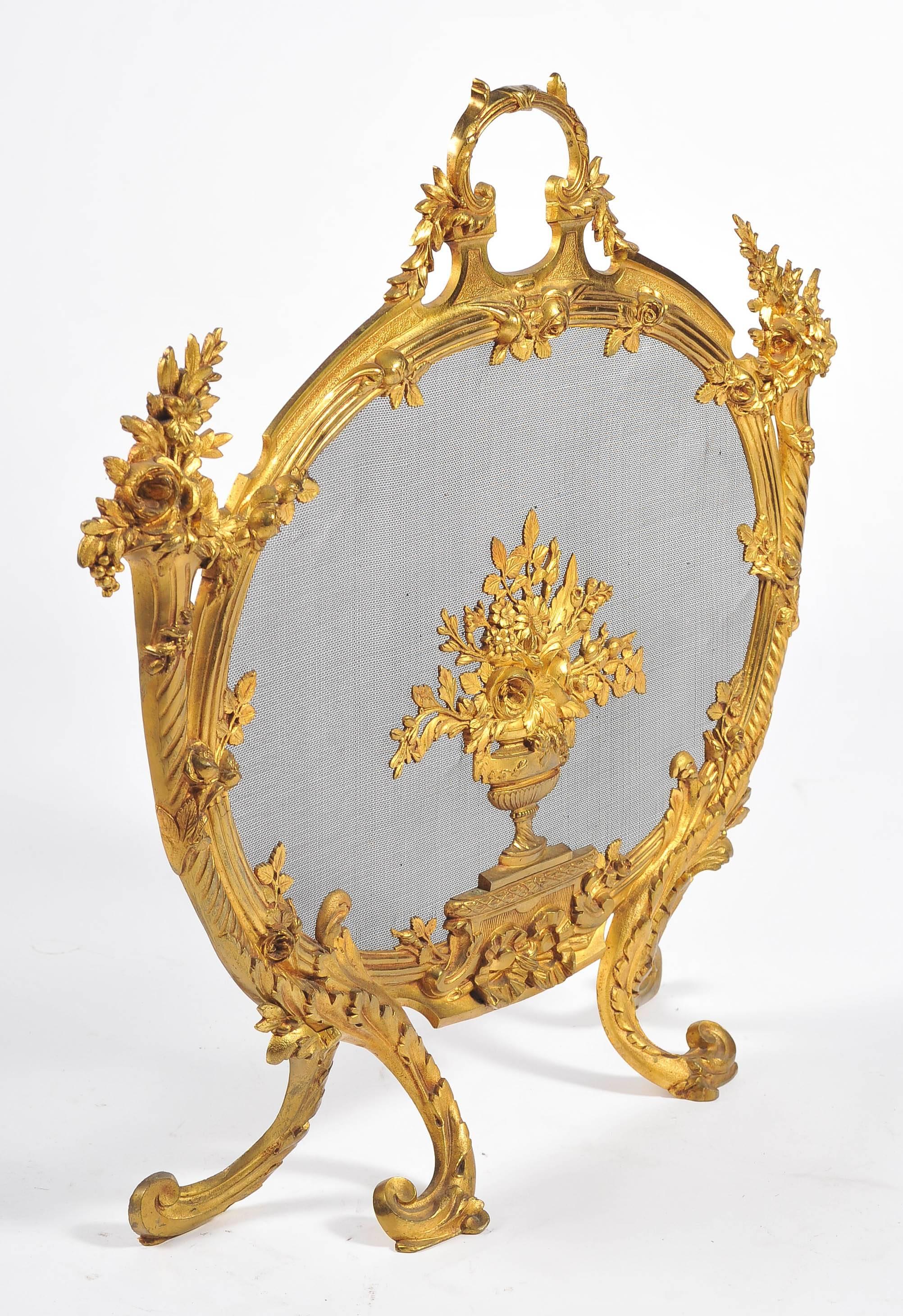 A very good quality 19th century French gilded ormolu Louis XV or Louis XVI style fire screen. Having wonderful cornucopia on either side with flowers, C scroll and foliate decoration framing a vase of flowers to the centre.