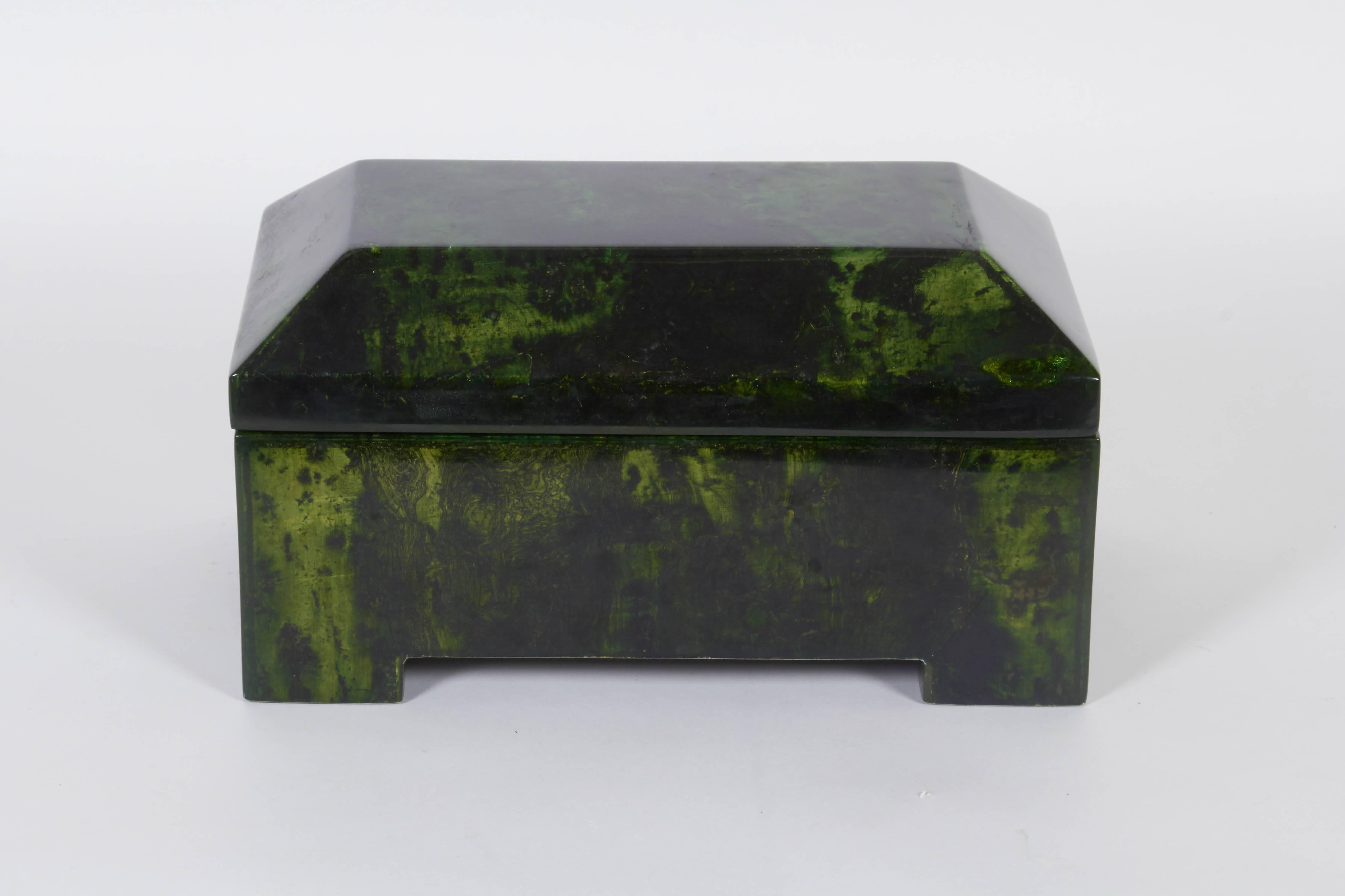 A modern deep green decorative box designed by Enrique Garcel, produced in Colombia, circa 1980s, heavily lacquered with hinged top and brass hardware. Markings include maker's label to the underside. Very good condition, minuscule wear consistent