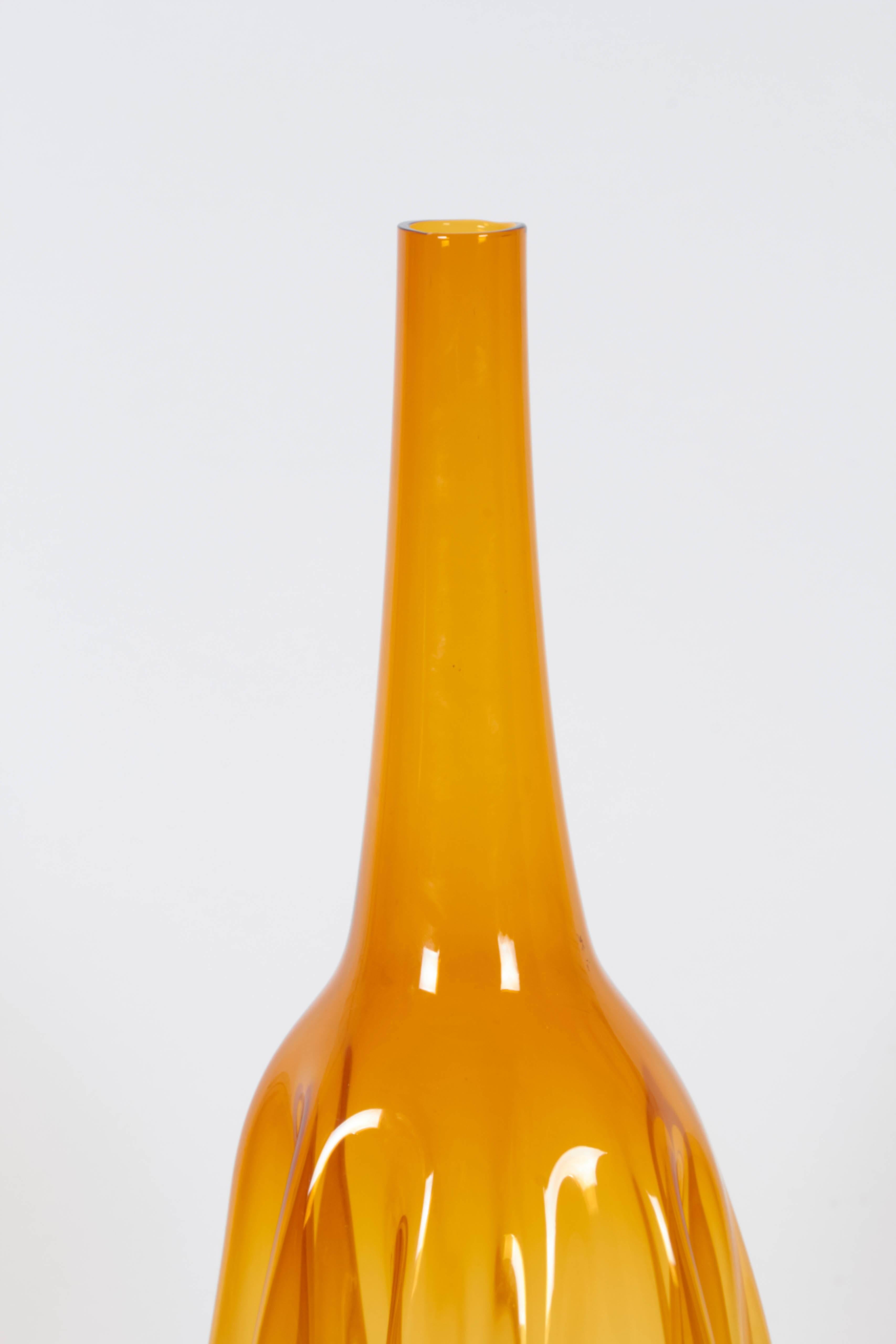 A huge blown glass vase by Zeller Glass Co. of Morgantown, OH, produced circa 1960s, of bottle form in amber with folded sides. Excellent vintage condition, wear consistent with age and use.

11047